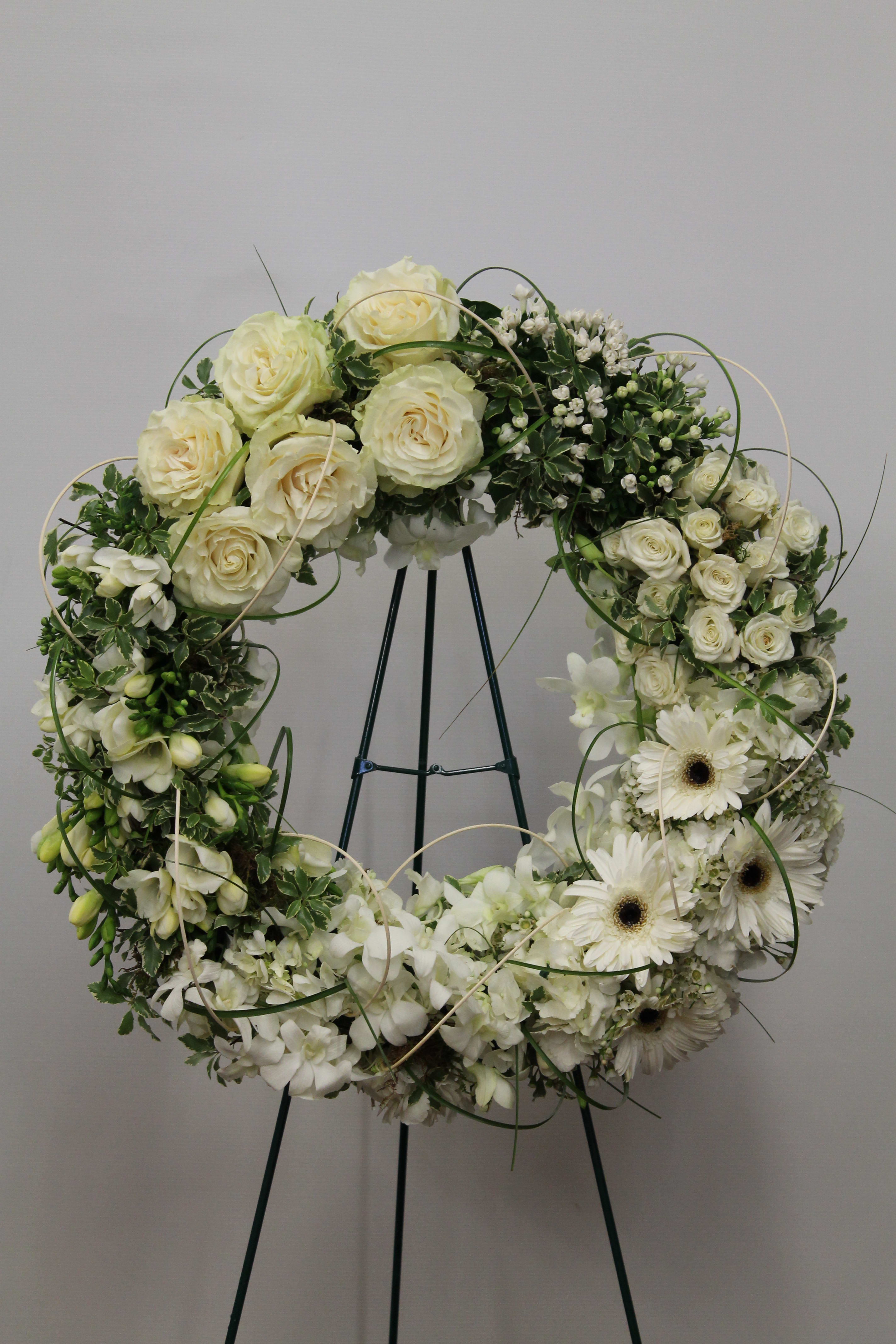 The Funeral Wreath The Funeral Wreath - Bouvardia, Orchid, Rose, Gerbra, Freesia, Spray Rose