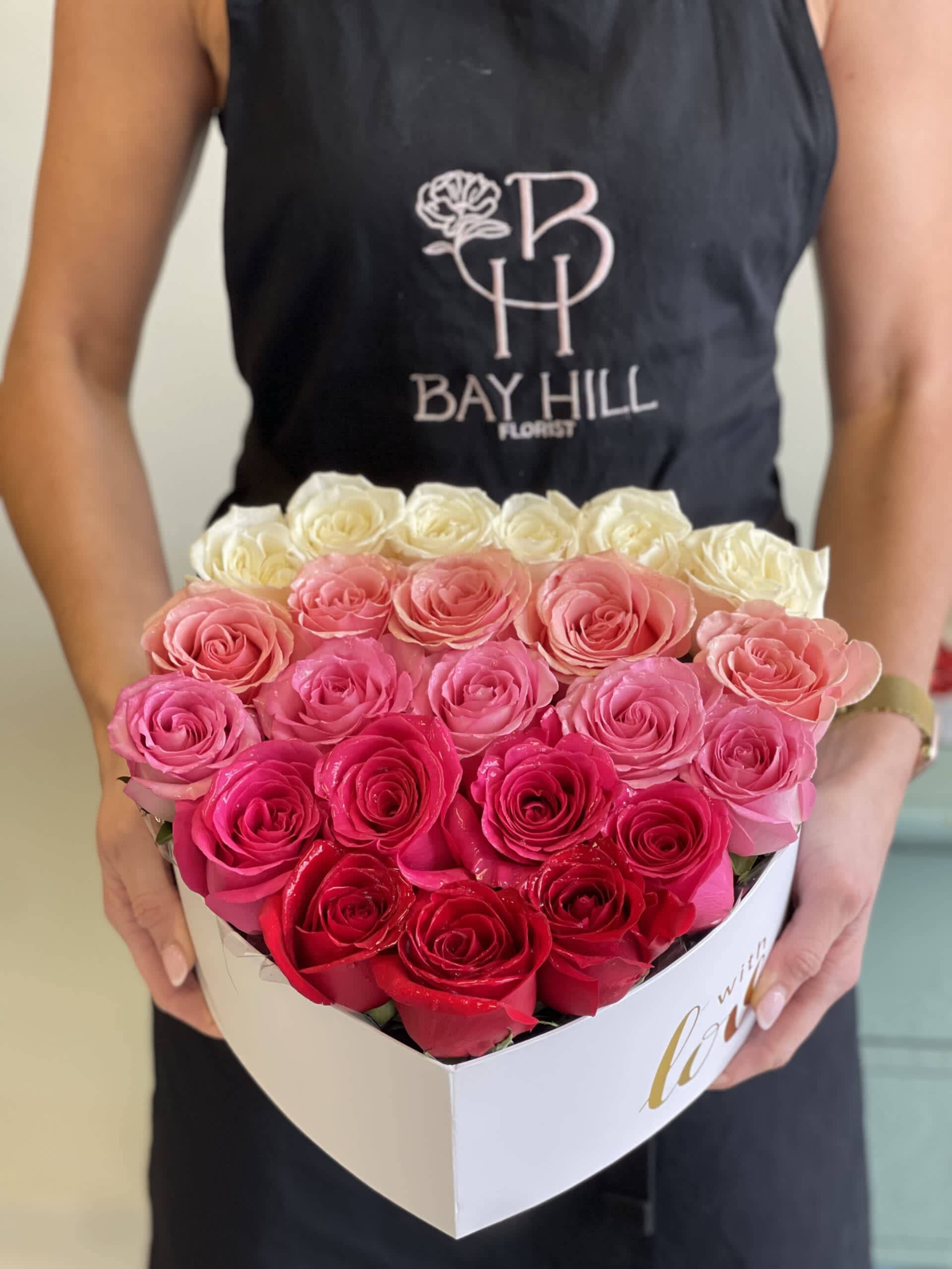 Ombre Heart Box Ombre Heart Box - 24 premium roses carefully placed into a heart box! Enjoy 5 different shades of colors! Shades of pink may vary. Currently available in one shade of pink.