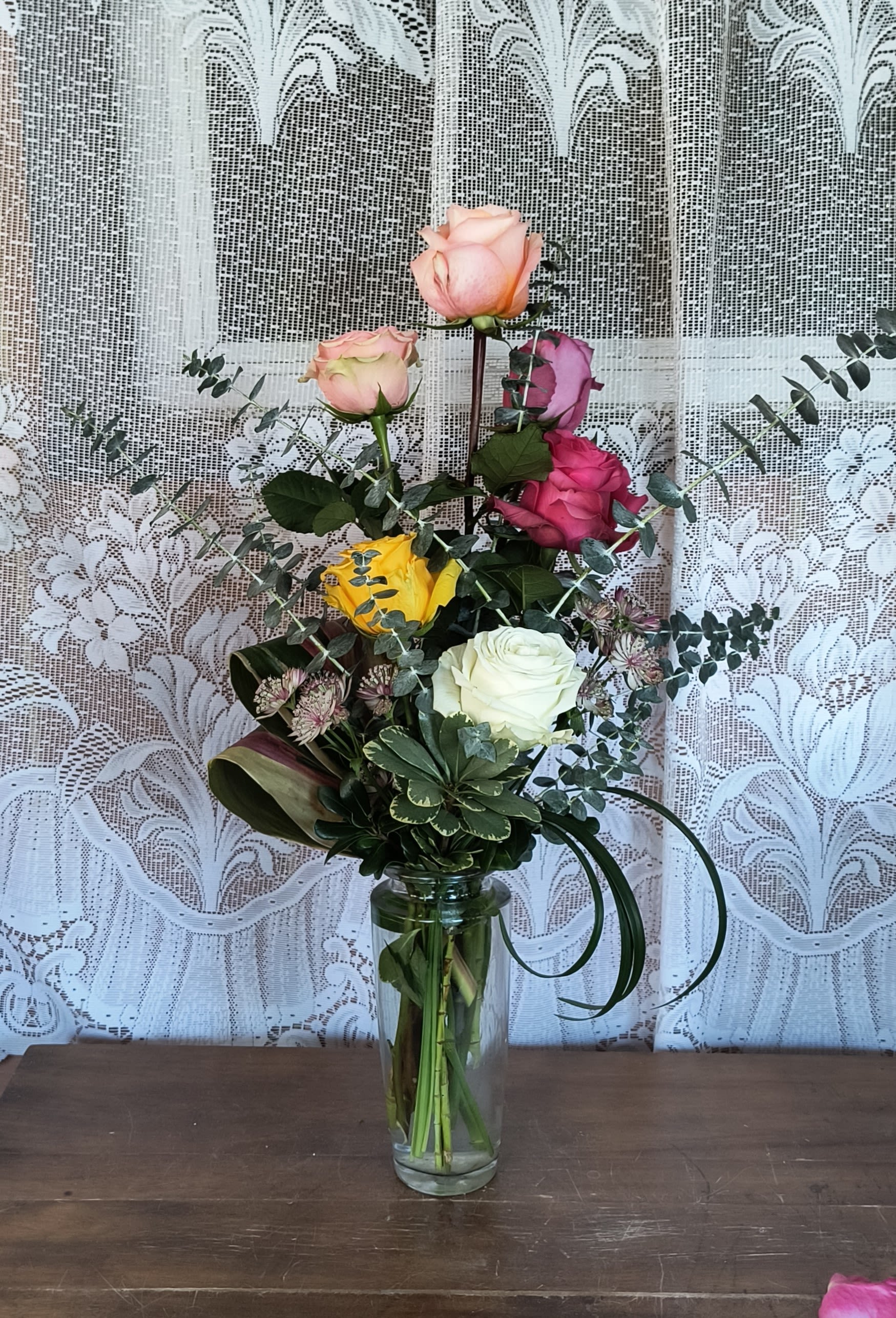 Jubilee Jubilee - A designers choice of a beautiful assortment of roses arranged in a glass vase, colors will vary depending upon availability.