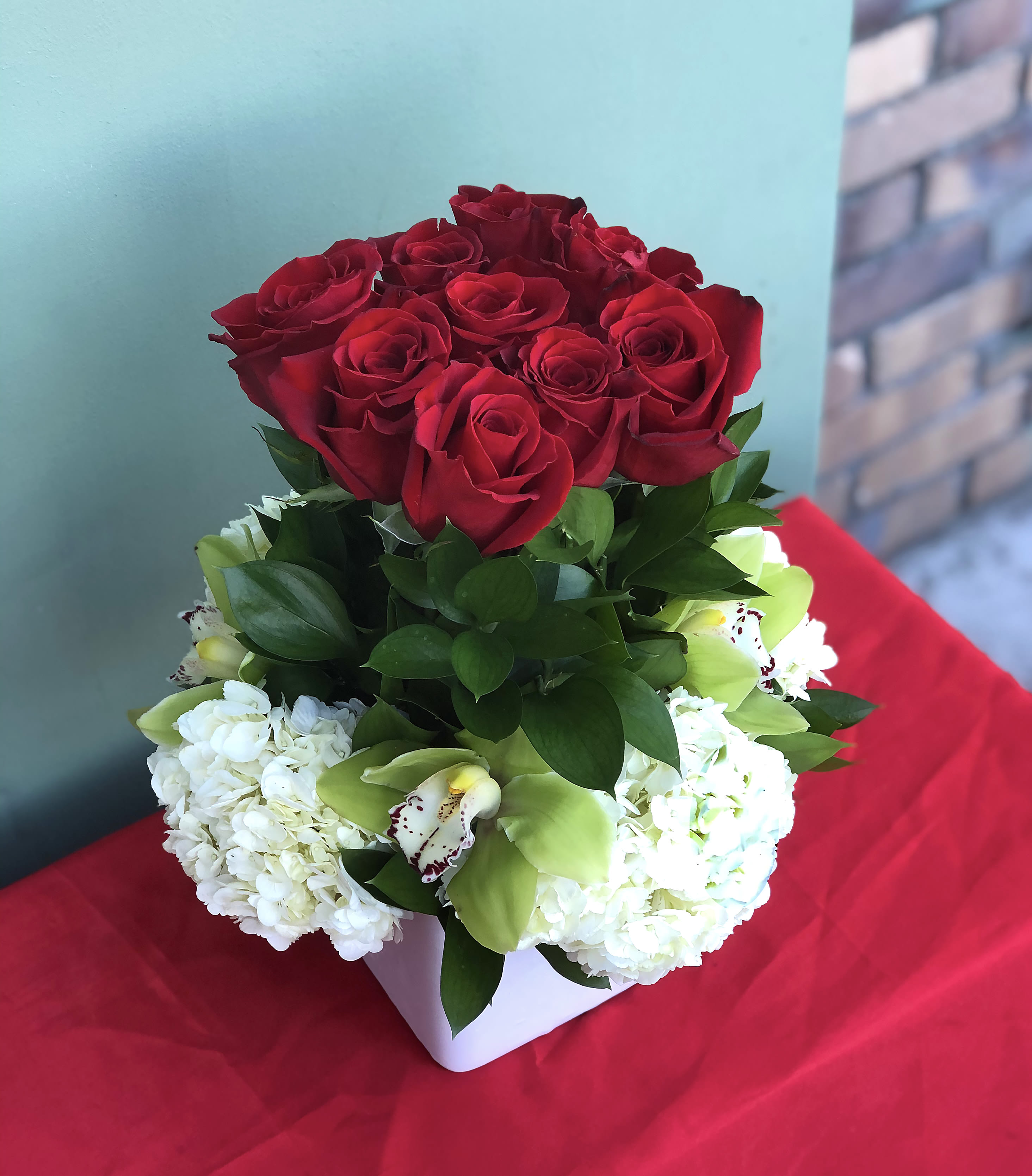 Eternal Love - An arrangement of roses and orchids designed with love for your most precious moments  Approximate Size: 13&quot;High and 10&quot;Wide