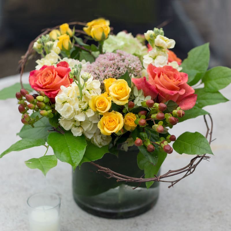 Autumn Mix  - Hydrangeas, sedium, hypericum berries, yellow stock, lemon leaf, honey suckle vine, and orange marianna roses all make up this seasonal mix. 