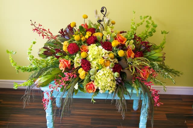 Sympathy Casket Cover- Granbury Funeral Flowers  - Gorgeous Blanket of Redd, Yellow, Bright Greens, Oranges etc including Hydrangea, roses, bells of ireland, orchids, monkey paw, mixed greens etc delivered to Wiley’s or Martins Funeral Home 