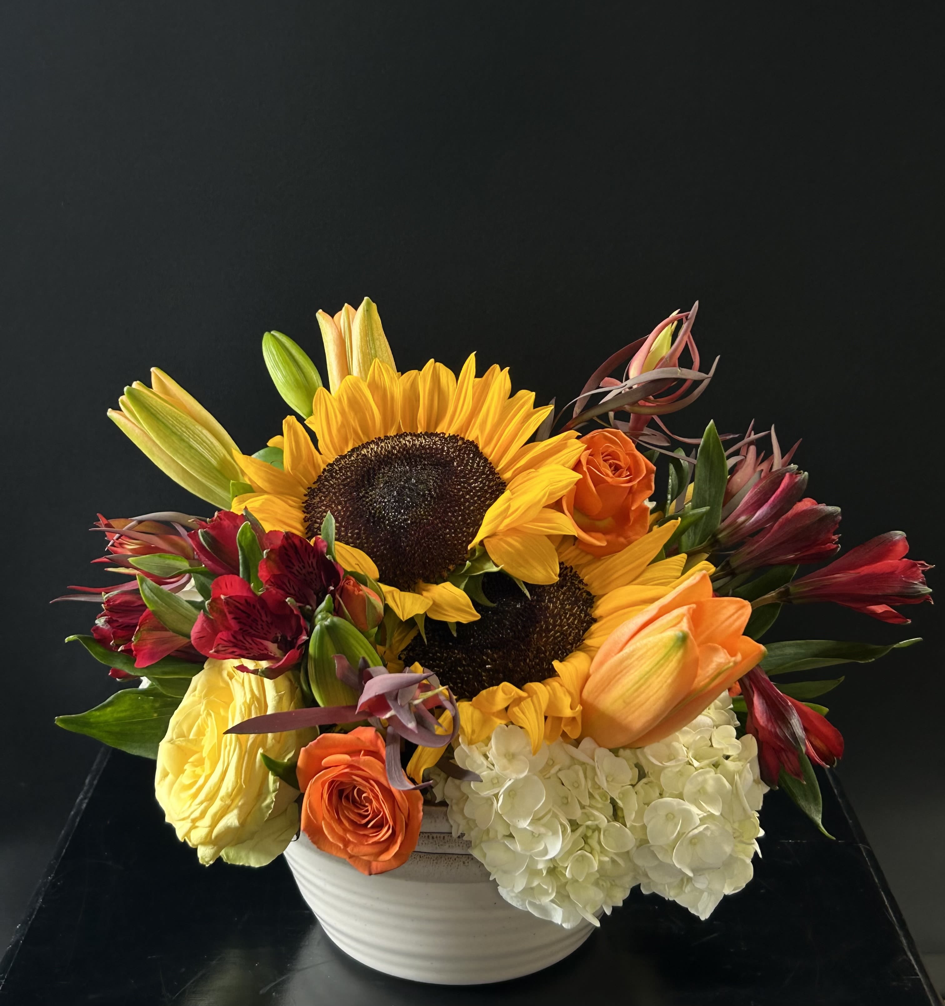 Fall Harvest - Yellow, orange, red, and white flowers in a beautiful cream and tan bowl.  A great way to welcome fall!