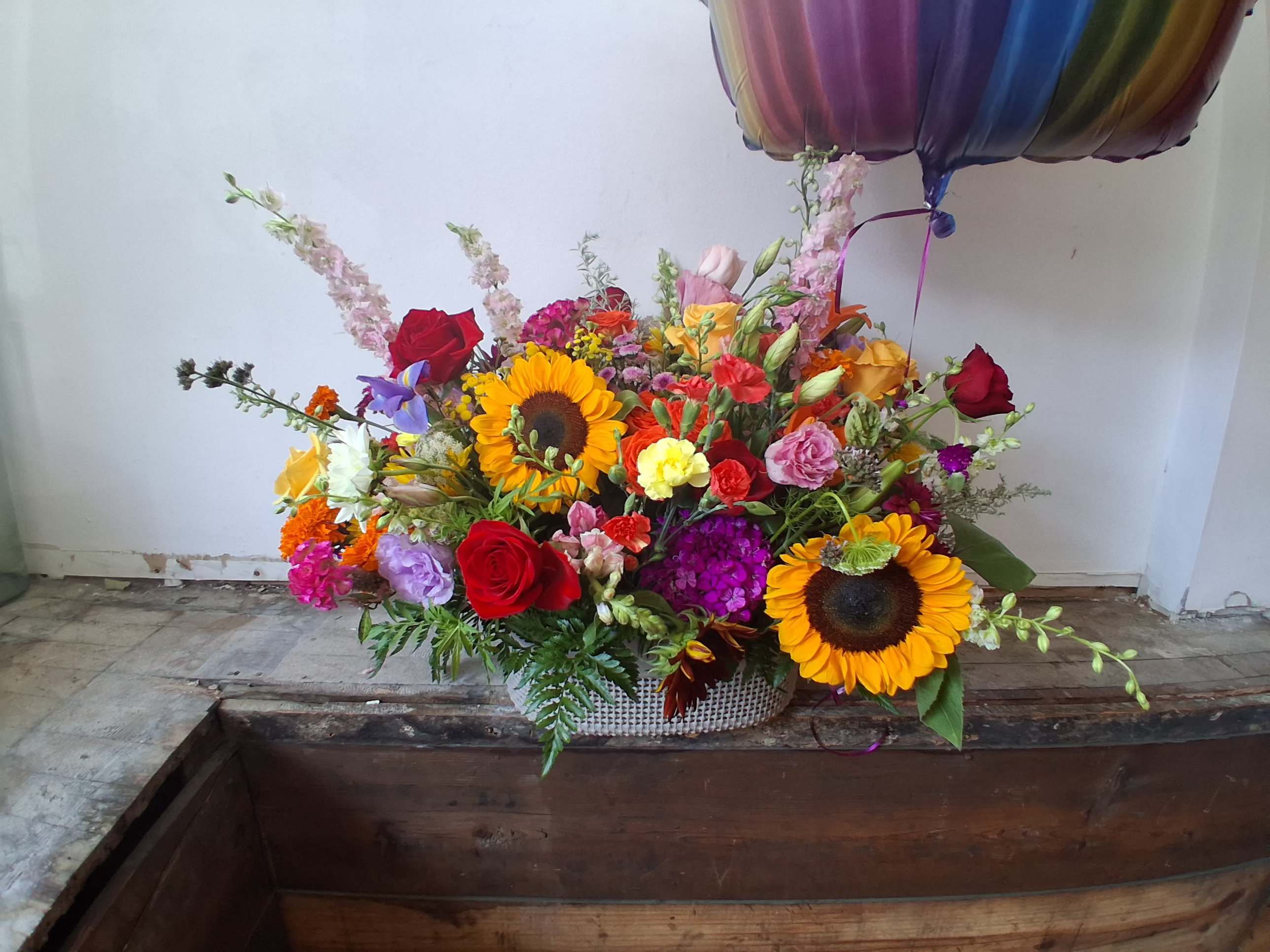 Happy celebration bascket - Beautiful assorted &quot;celebration&quot; colors flowers/ roses, alstroemeria, carnations, daisies, lisiantus, sunflowers and other fillers/ ballon has to be added separately.