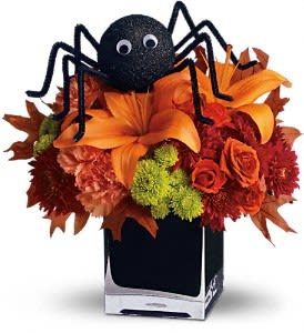 Spooky Sweet - Perhaps this is the perfect WEB bouquet. Perched atop a beautiful array of fall flowers, the only place this sweet spider will crawl is right into someone's heart.