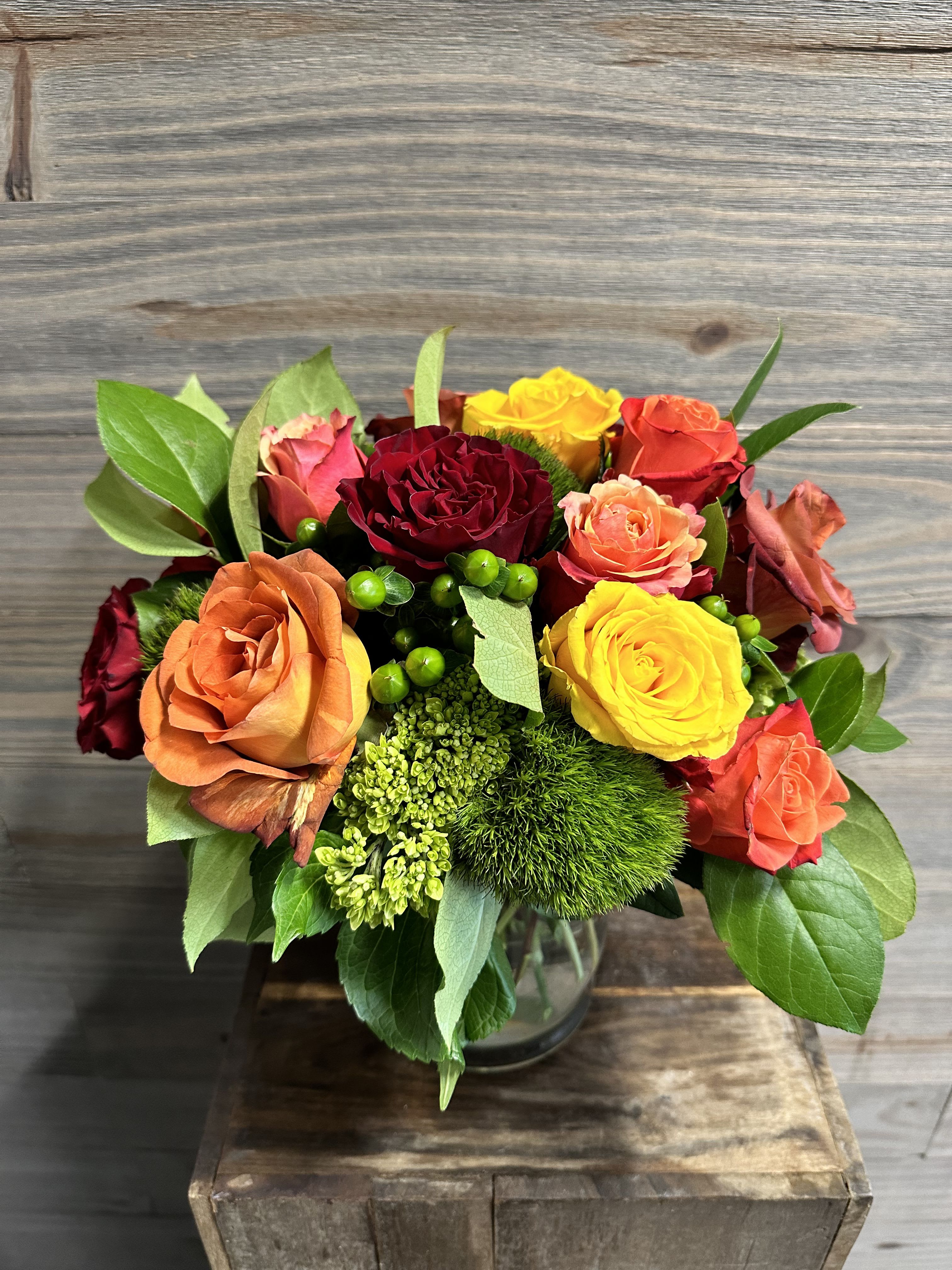 Falling Roses - A textured bouquet of fall themed roses with accenting flowers.