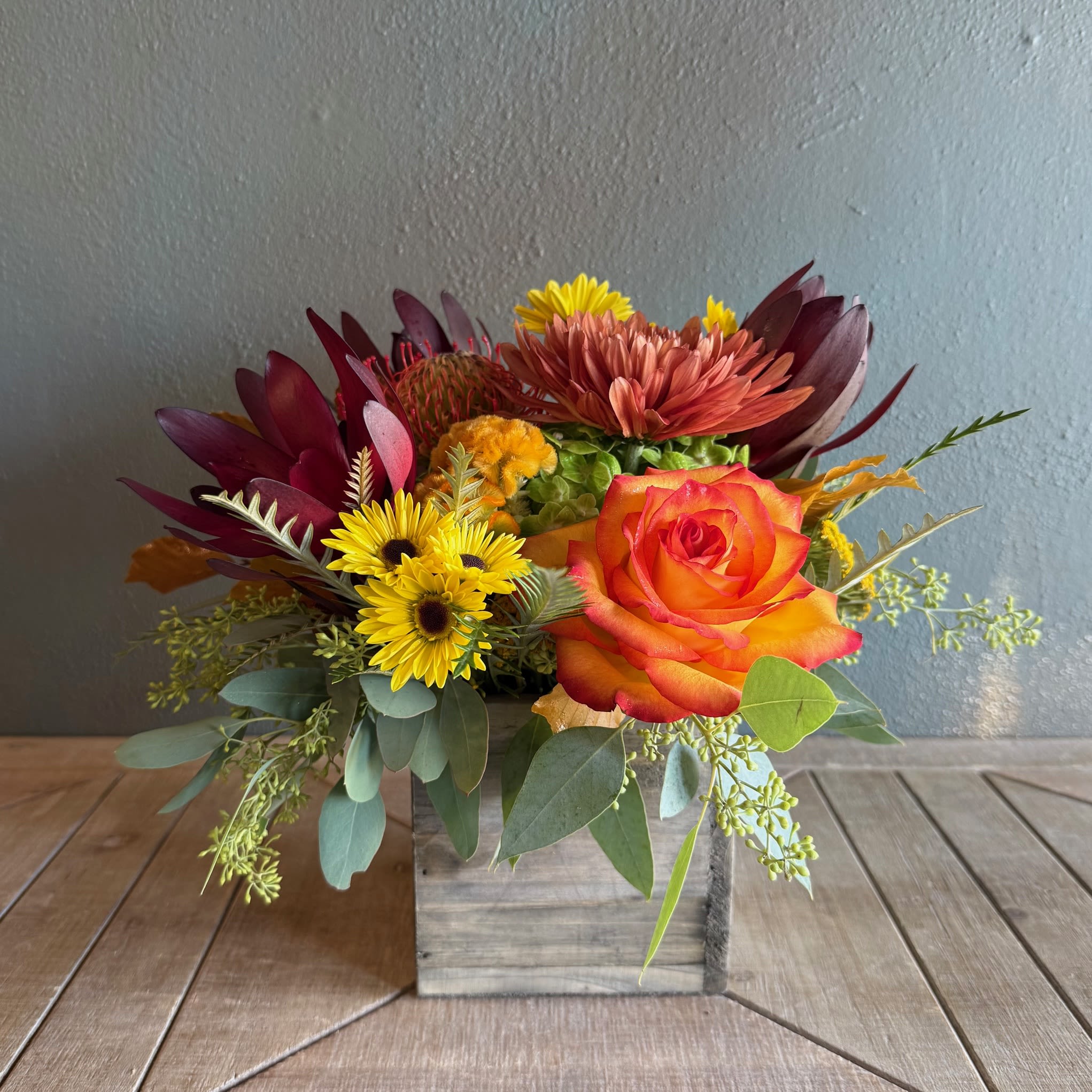 Rustic Radiance - Bringing the rustic warmth of the season into your home, this arrangement will have anyone falling for it!