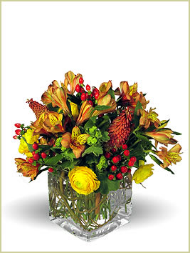 Color of Autumn - An elegant glass vase is filled with the warmest colors and styled with a european flair, delivered by a real Portland florist.