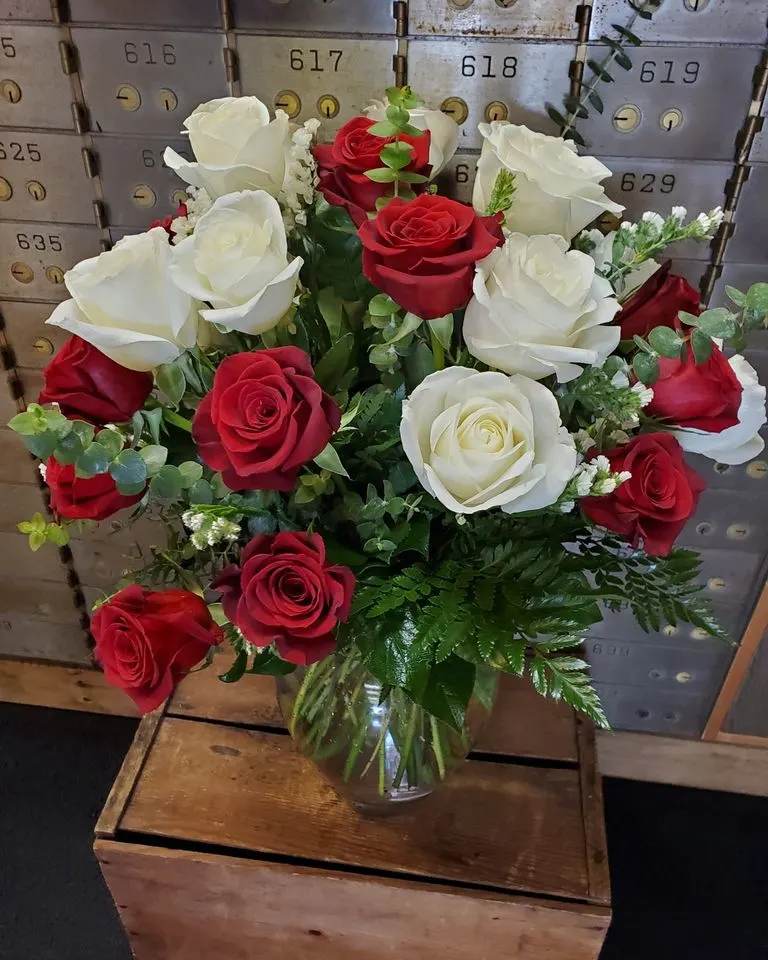 Unity of Love – Two Dozen Red &amp; White Roses - Unity of Love – Two Dozen Red &amp; White Roses Celebrate love in its purest form with our Unity of Love Bouquet, featuring 24 stunning roses in a timeless blend of passionate red and graceful white. Symbolizing deep devotion and everlasting unity, this bouquet is the perfect gift for anniversaries, weddings, or any occasion that honors love’s beautiful harmony.  Each rose is hand-selected for freshness and vibrancy, then thoughtfully arranged with lush greenery for a breathtaking presentation. Delivered with care by Adorkable Flowers and Gifts, this striking mix of red and white roses is more than a gift—it’s a heartfelt statement of love, respect, and togetherness..   * Some stages of flower life may vary. (Example: Lilies may be more open than imaged.)  Flower shortages and product availability means that some substitutions will apply. Value will always be filled. This bouquet might include eucalyptus amongst the greenery. It may be toxic to pets including but not limited to cats and dogs if digested.