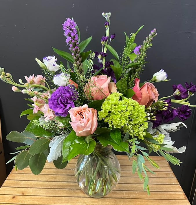 Graceful Elegance - Chic, modern, and effortlessly beautiful, our Graceful Elegance Bouquet features a stunning one-sided arrangement of fresh flowers and lush greenery in a stylish vase. Perfect for tabletops, desks, or cozy corners, this design showcases blooms in a way that feels airy, sophisticated, and full of life.  Each stem is hand-selected for freshness and vibrancy, arranged to highlight the natural beauty of every flower. Delivered with care by Adorkable Flowers and Gifts, this bouquet is a thoughtful gift or a charming addition to your own home décor.  * Some stages of flower life may vary. (Example: Lilies may be more open than imaged.)  Flower shortages and product availability means that some substitutions will apply. Value will always be filled. This bouquet might include eucalyptus amongst the greenery. It may be toxic to pets including but not limited to cats and dogs if digested.