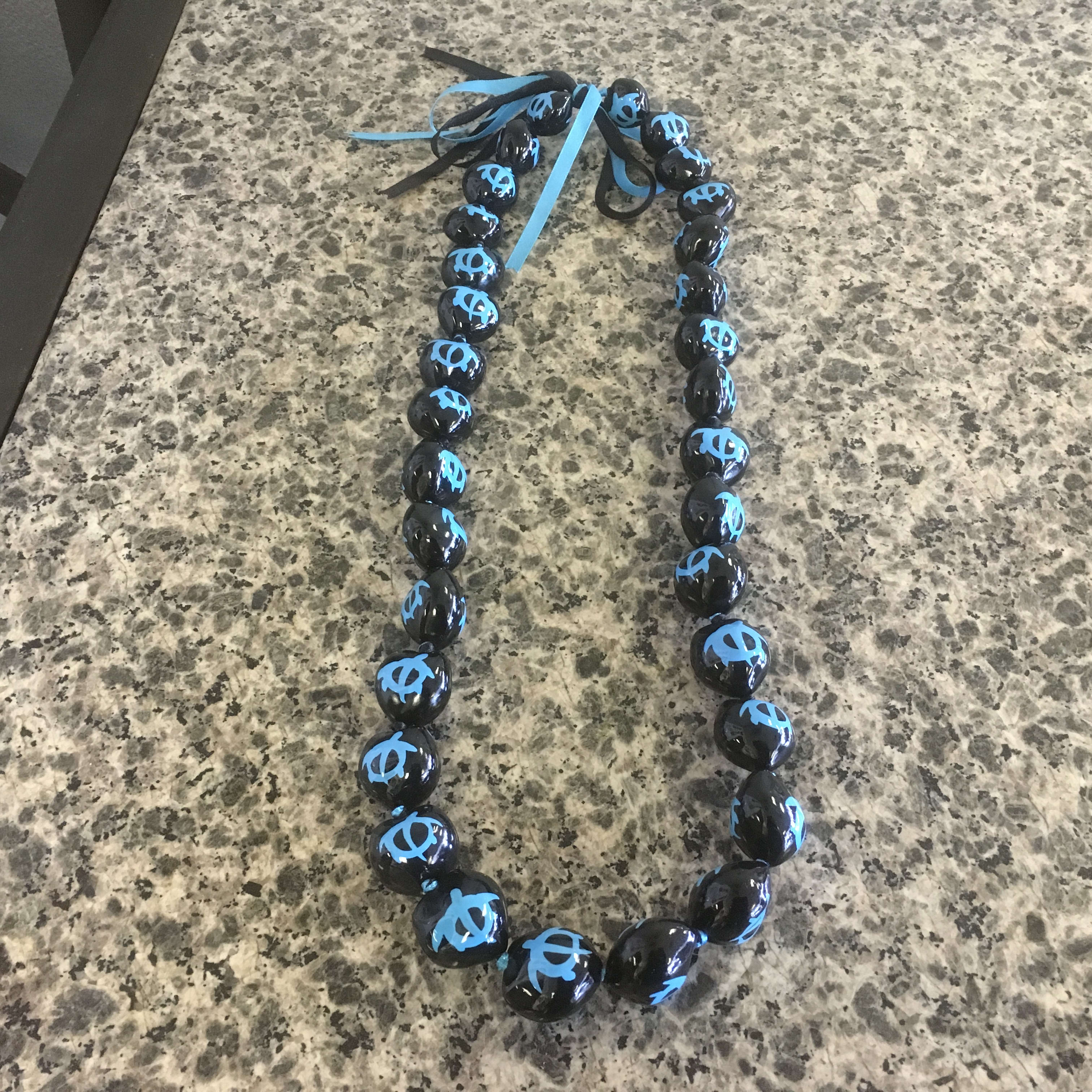 Kukui Nut Lei - Blue Turtle Kukui Nut Lei - Blue Turtle - Perfect for the Graduate! Call to pick up in store (480)968-0389