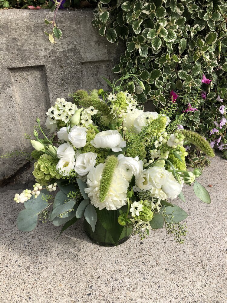 Fall 20 Fall 20 - Flower arrangement in a vase with white lisianthus, ranunculus, Dahlia, snow berries, green hydrangea, star of bethlehem, bunny tail grass and some greenery. *Depending on availability, flowers may change