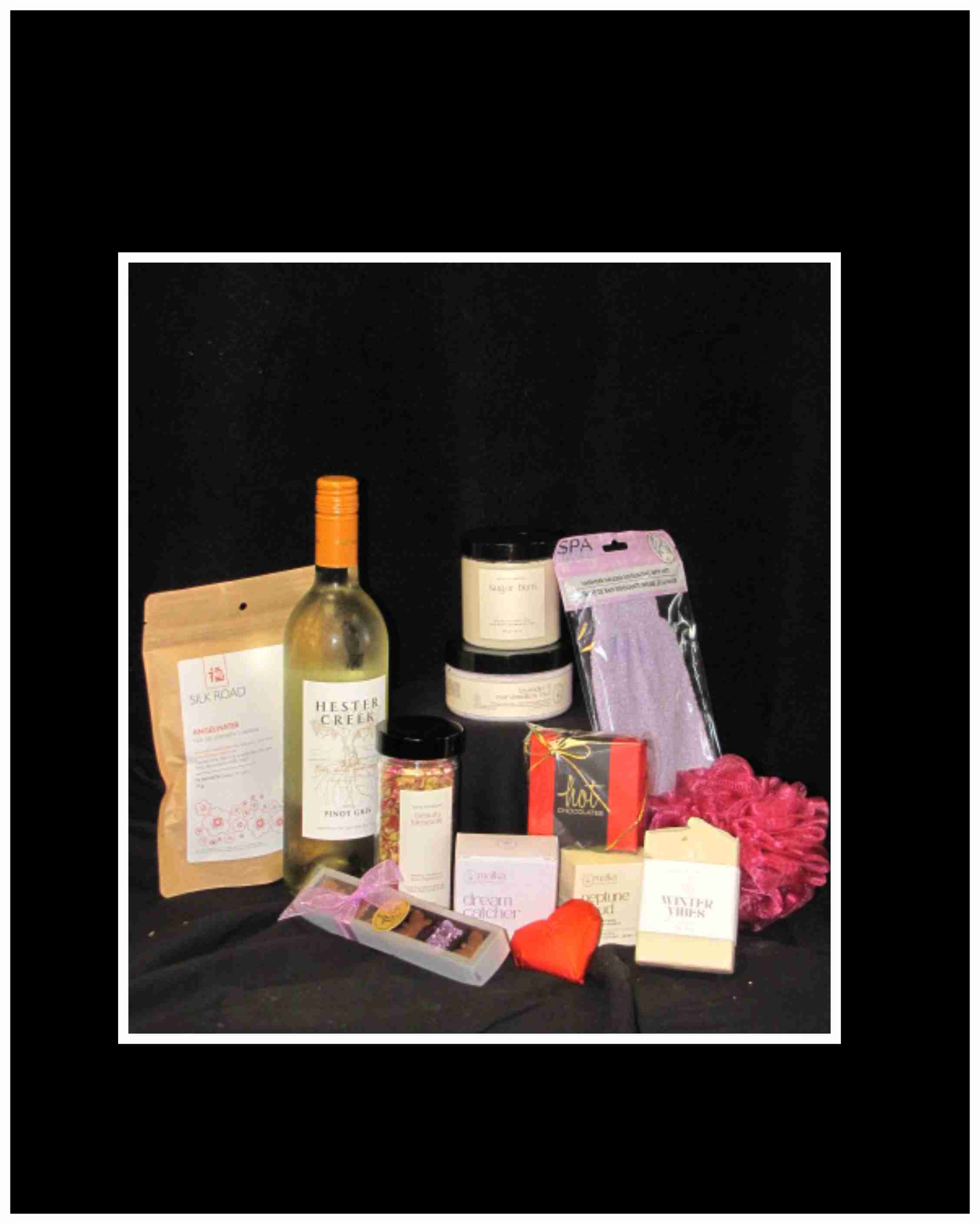 Serenity Spa Basket - A gift of luxury pampering featuring local Nanaimo based products from Matka botanicals that uses pure ingredients and is made in small batches. This basket also includes Vancouver Island Silk Road Tea and chocolates from Hot Chocolates. A bottle of wine is included to complete the serene home spa experience    (Working hard to promote local products)  Local delivery only