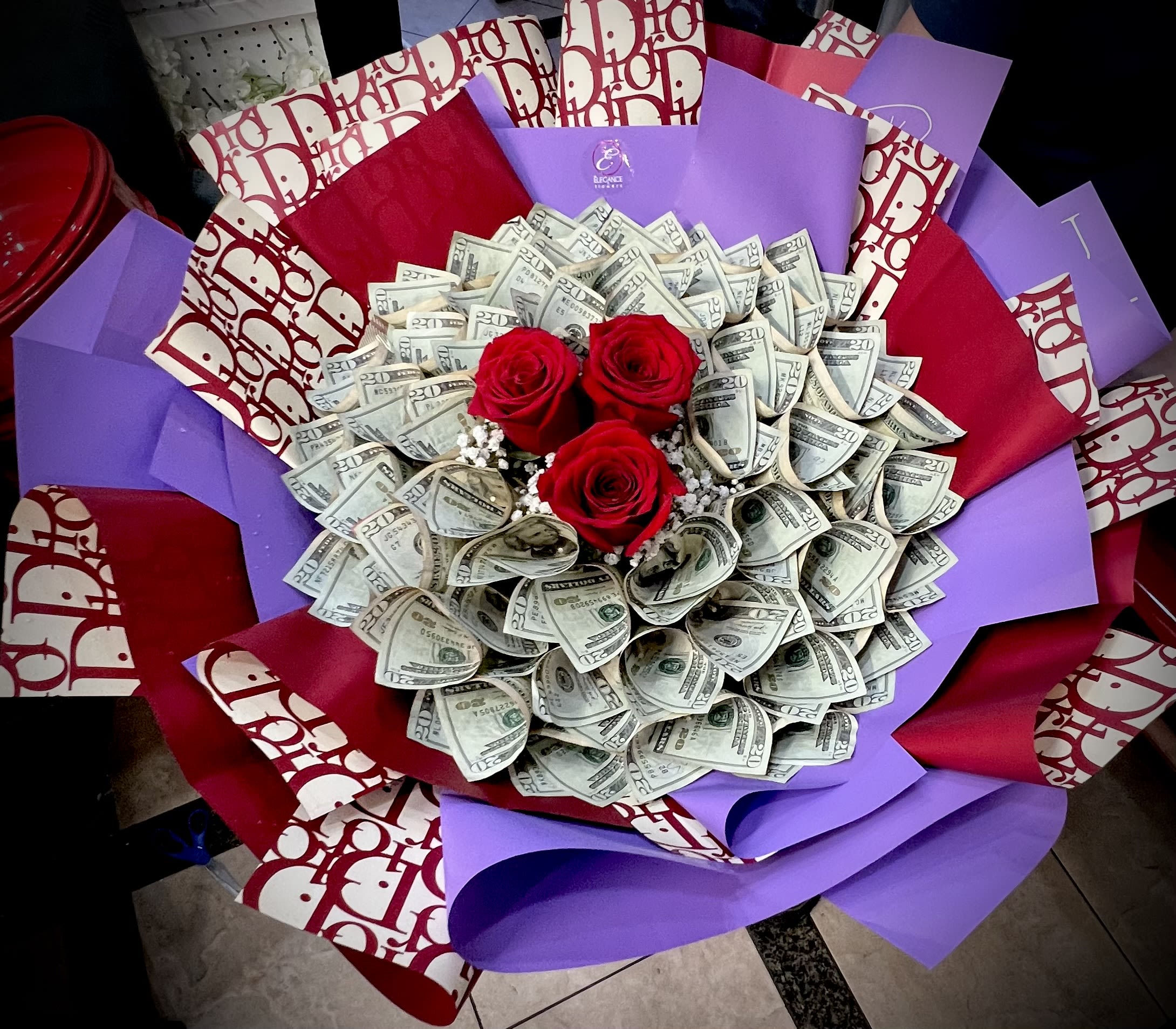 Money Bouquet #17 Money Bouquet #17 - Includes $20x 50 ($1000) Please place your order 2–3 days in advance to ensure availability. For questions, call us at 281-564-2600.