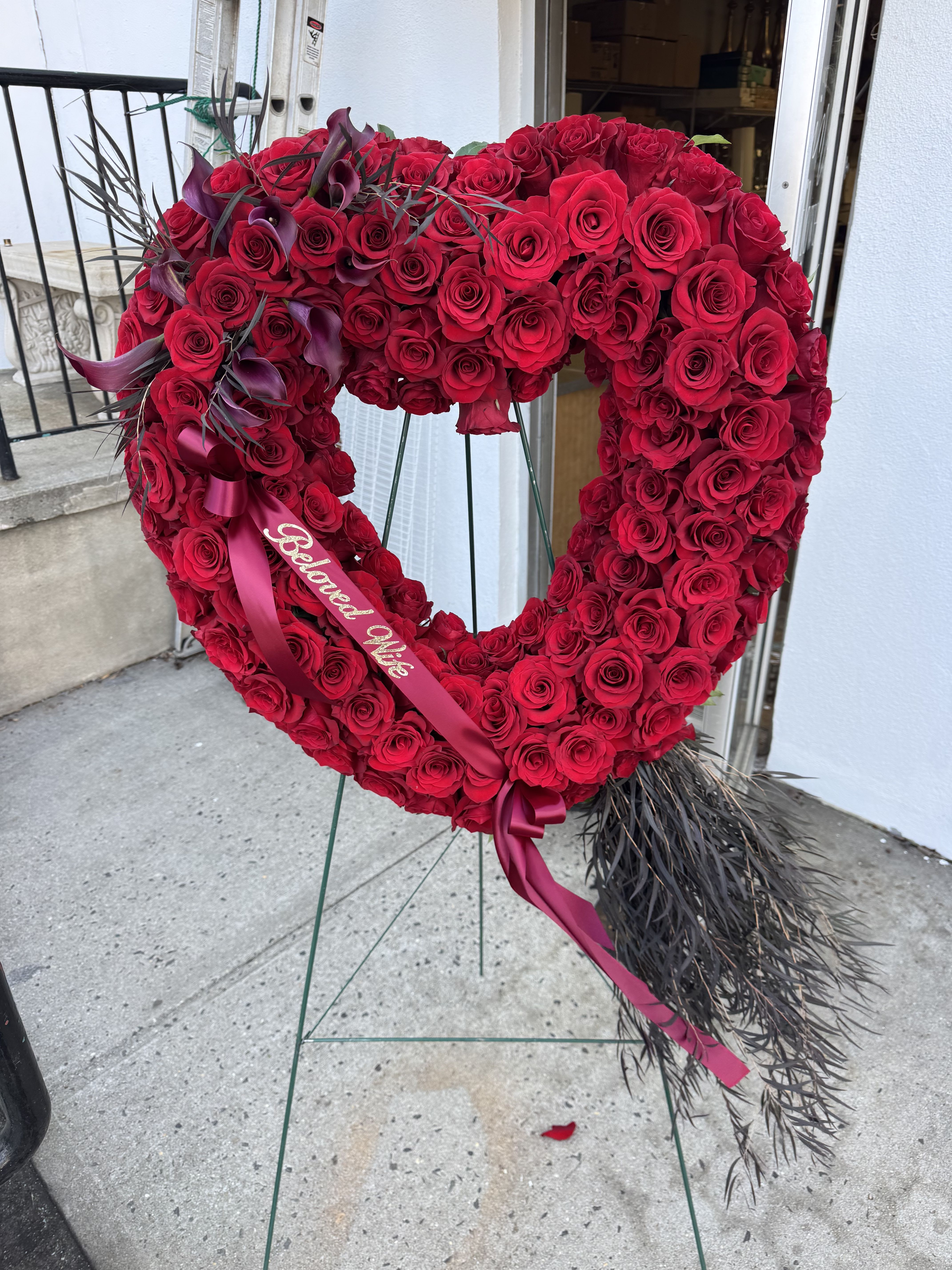 Eternal Love Open Heart - Honor a loved one's generous spirit with this classic open-heart design, a timeless symbol of devotion. Crafted from 150 rich red roses, accented with elegant calla lilies and fresh greenery, its a heartfelt declaration of everlasting love.
