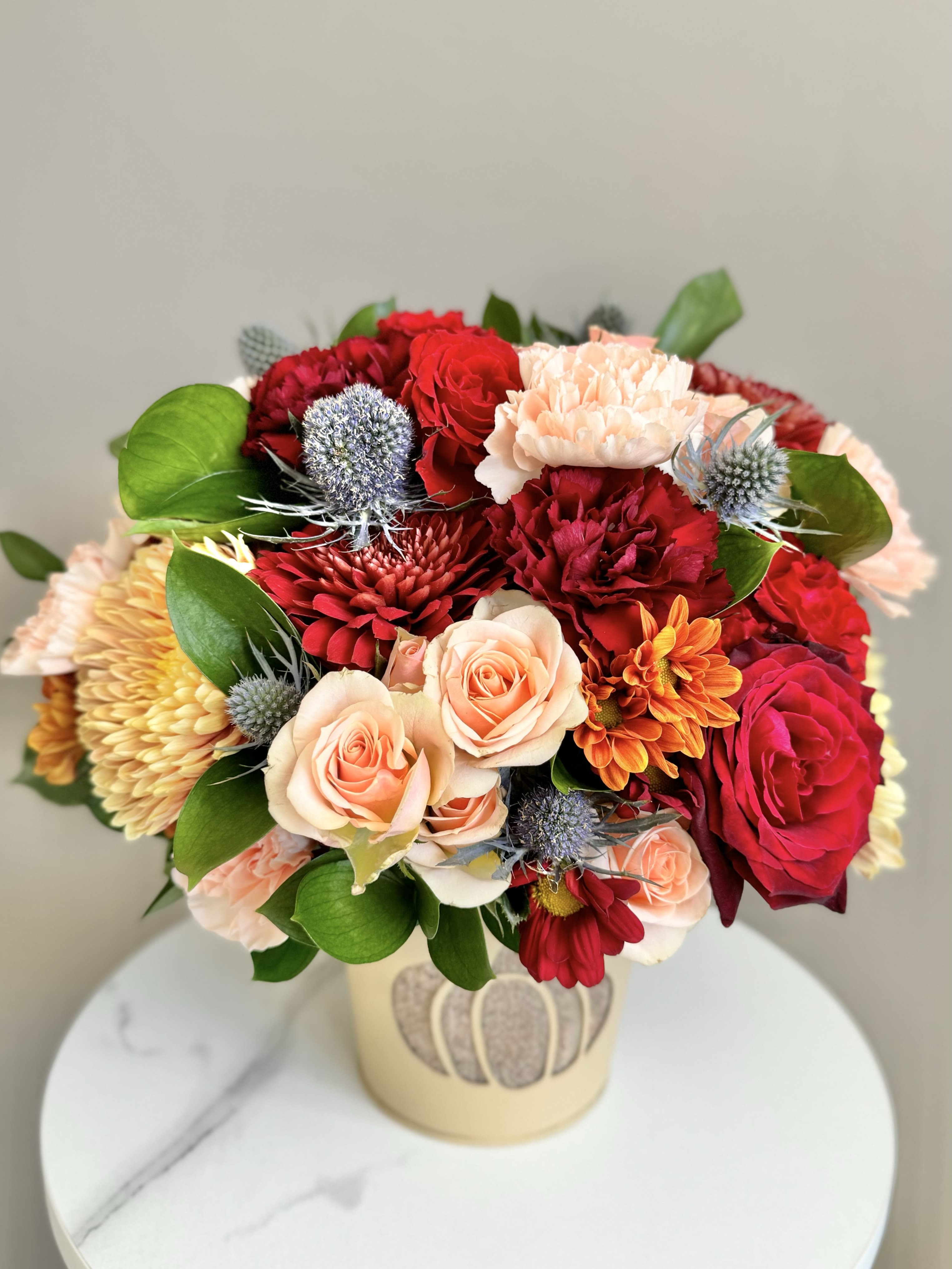 Fall Harvest Bouquet - These are not your regular Fall Arrangement! These are perfect gifts for Fall Birthdays and Fall Anniversaries. These flowers are what you’d want to bring as a gift to impress the host of a party this fall season. They are also perfect for your own home, adding Fall Vibes to your dining table or living room!  Fresh Flowers and colors will be reminiscent of the beautiful Fall Season. Arrangement comes in a fall themed tin container that can be repurposed later. 