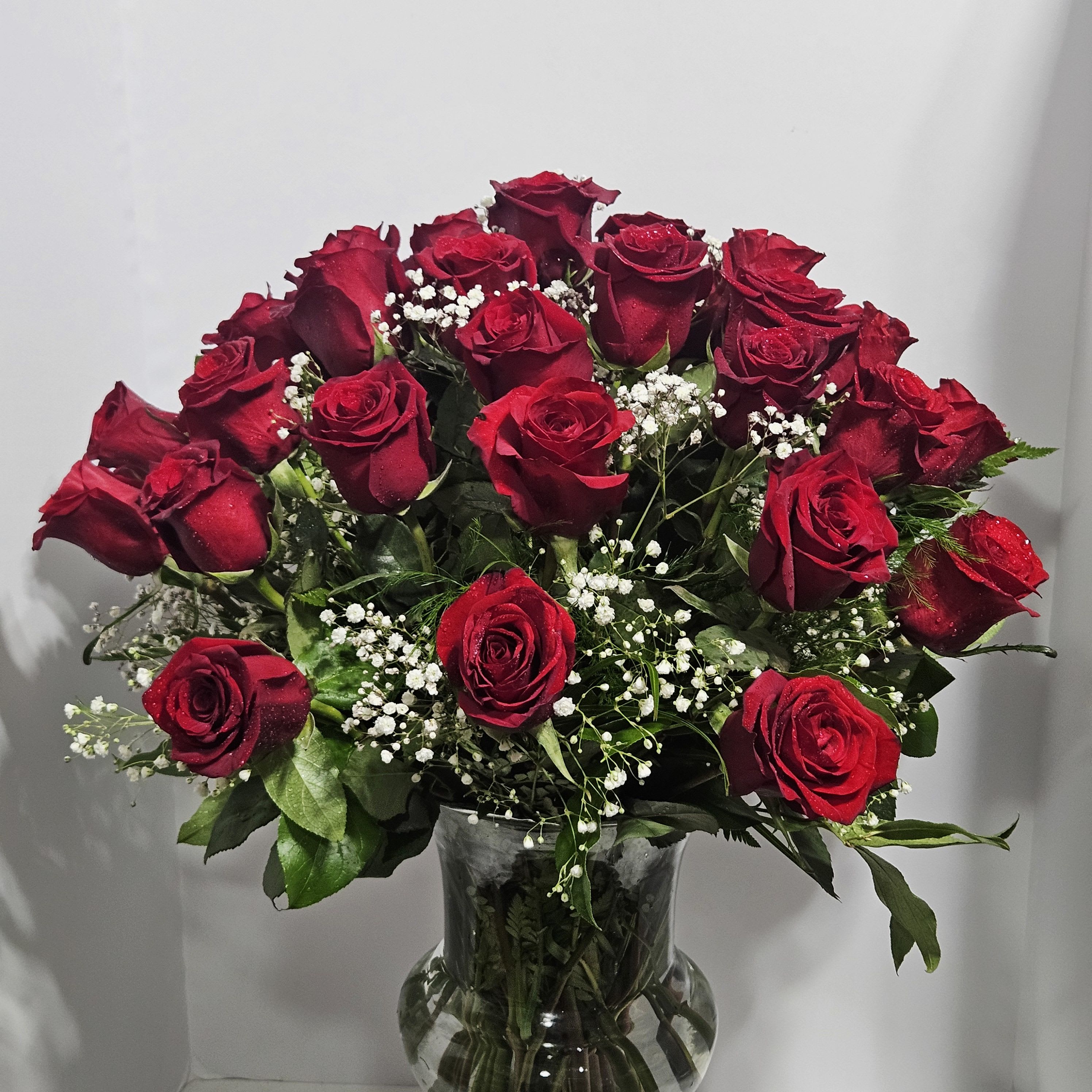 Ultimate Elegance Long Stem Red Roses - Because your sweetheart deserves to be romanced with all the love in your heart, send a luxurious bouquet of the freshest long-stem red roses. Whether you choose three, four or five dozen, each truly original arrangement is hand-gathered by our select designers in a classic glass vase to help you express yourself perfectly. Available in bouquets of three dozen roses  at regular price; four dozen roses at deluxe price and five dozen roses at premium price, hand-arranged in a classic clear glass vase. Our designers hand-design each arrangement, so colors, varieties, and container may vary due to local availability.  To request a specific color scheme, please note in special instructions.