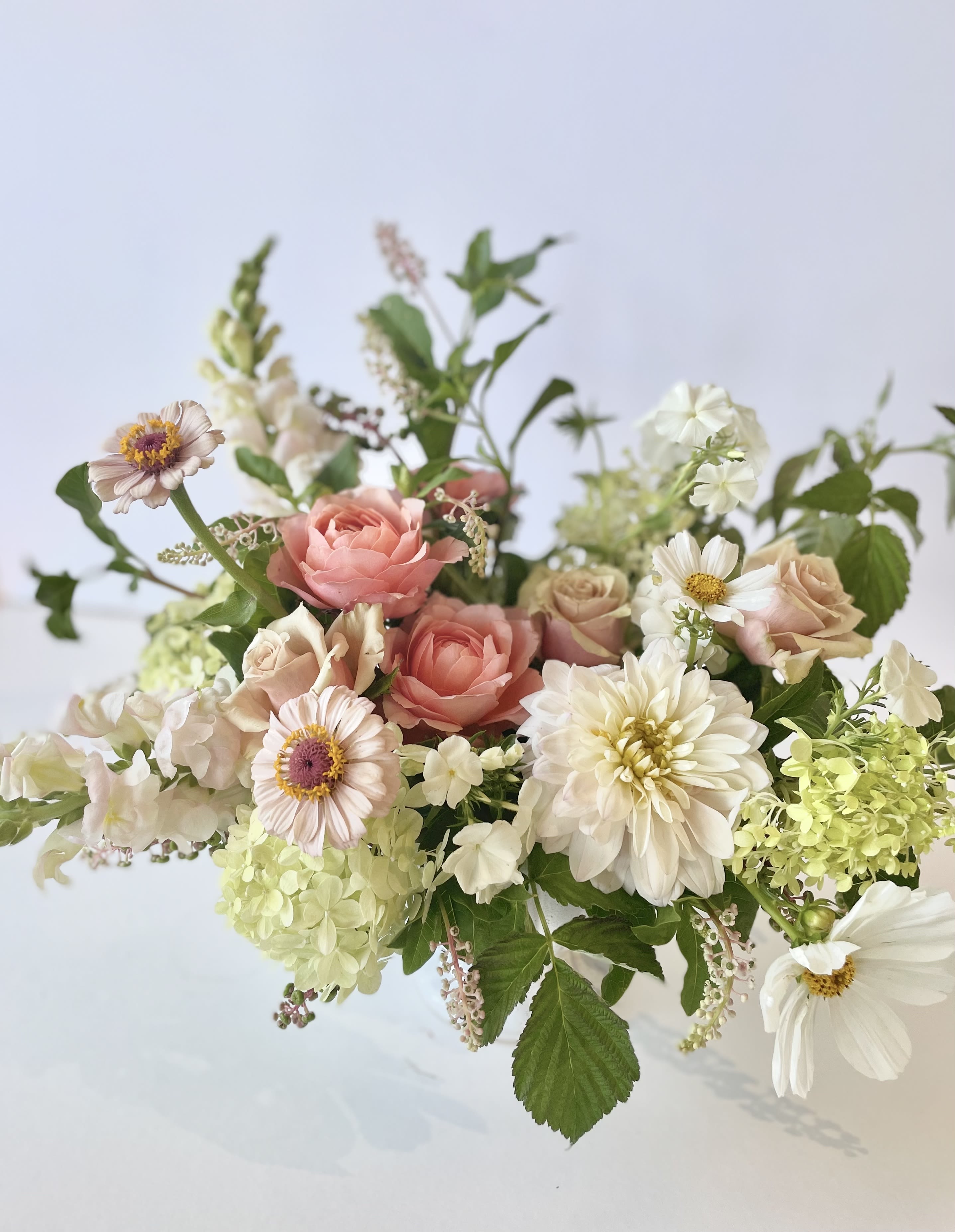 &quot;Blush&quot; Arrangement *DELUXE SIZE PICTURED* - **PICTURED IS THE DELUXE SIZE*   This arrangement is full of fresh seasonal flowers in a beautiful white, pink and blush palette.   Concerning Seasonality: As a seasonal, locally-focused florist, we have different product to work with each week. Our focus is on creating a unique piece for each customer, with blooms that are fresh from local farms and growers. While the flower varieties and colors may vary, the quality and freshness will always be the best. It is an honor to have our customers' trust and confidence in our abilities and artistic eye.   Delivery Policy (**PLEASE READ**): Pick-ups at the studio are available after 2pm. Our daily delivery time frame is typically between 12- 3 PM. Please specify if you require a certain delivery time and we will do our best to accommodate it, or we will call you if we cannot.  We gently ask that those ordering flowers please be sure to include whether or not there is a gate we may need a code for. 