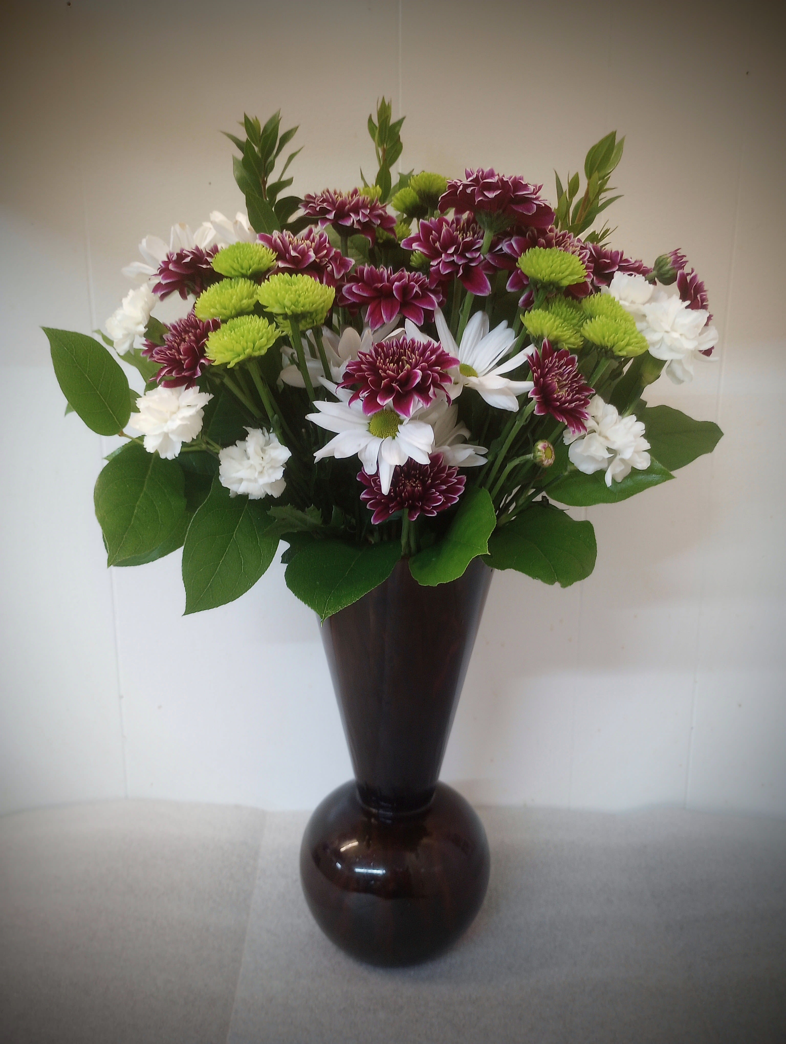 Purple art glass - This unique purple art glass vase comes with a bonus, long lasting flowers!