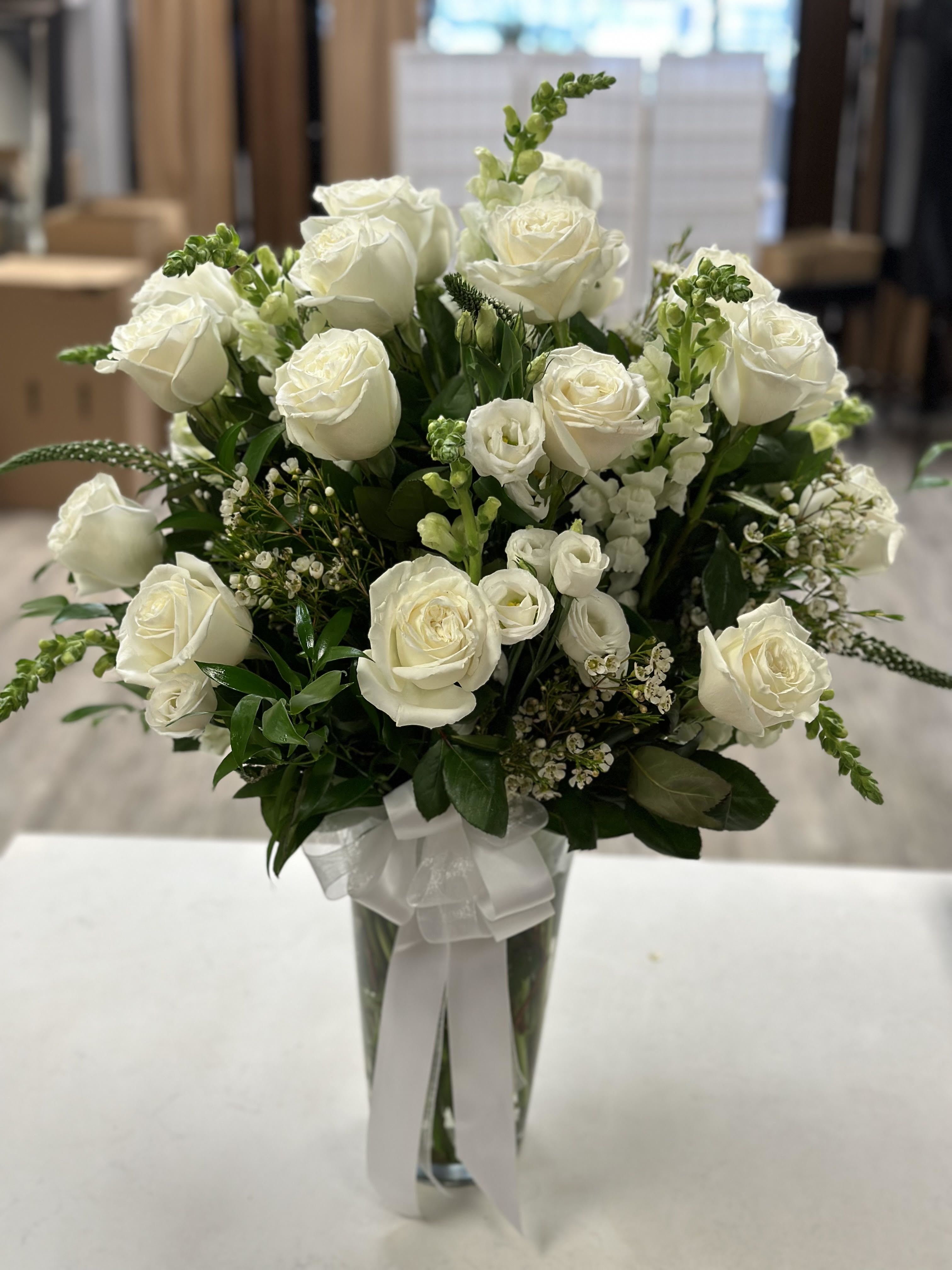 Whispers of Elegance - Whispers of elegance: white roses, lisianthus, and snapdragons in perfect harmony.