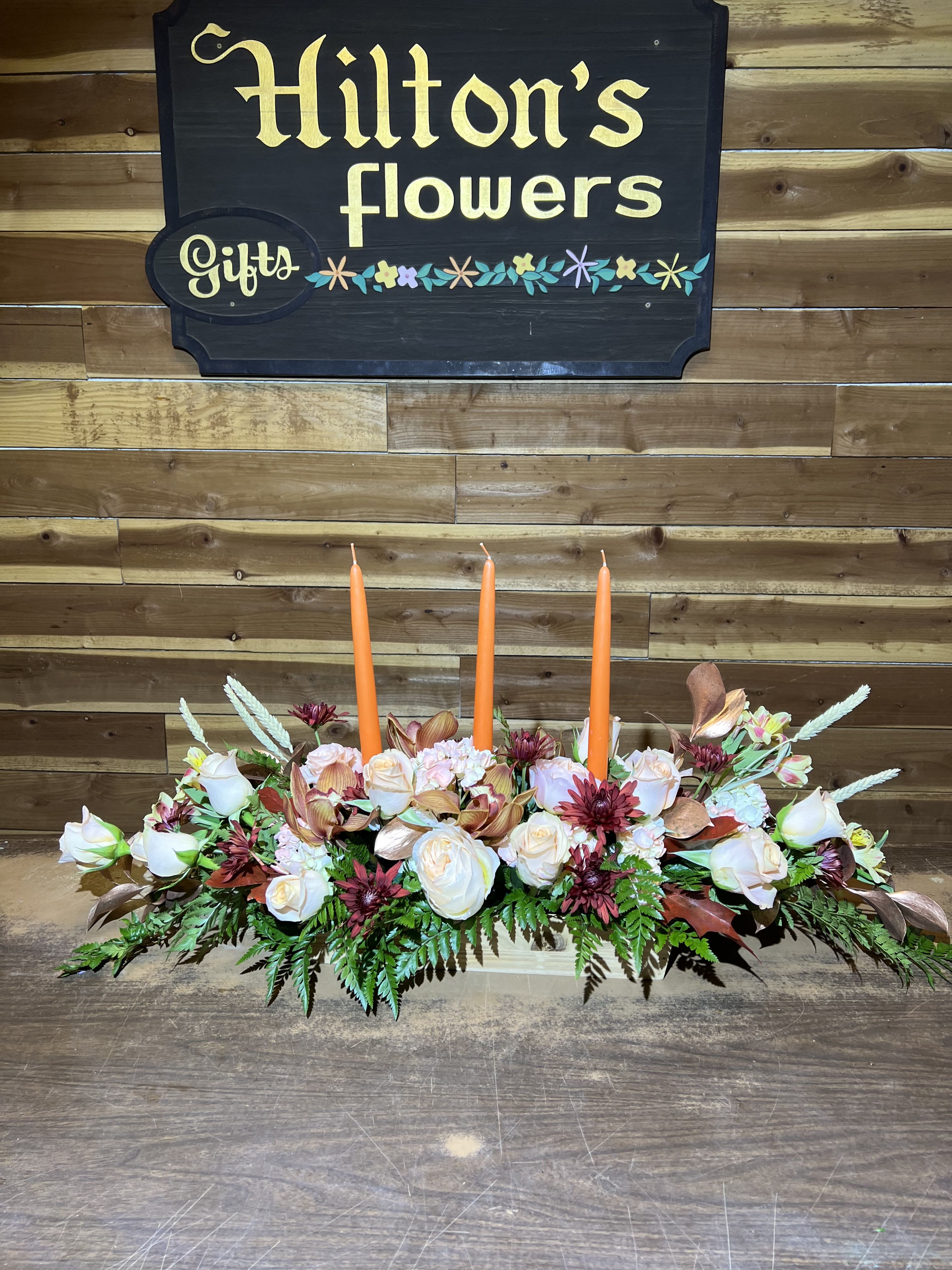 Centerpiece in Peach with Candle Centerpiece in Peach with Candle - long and low centerpiece in peach color with candles.