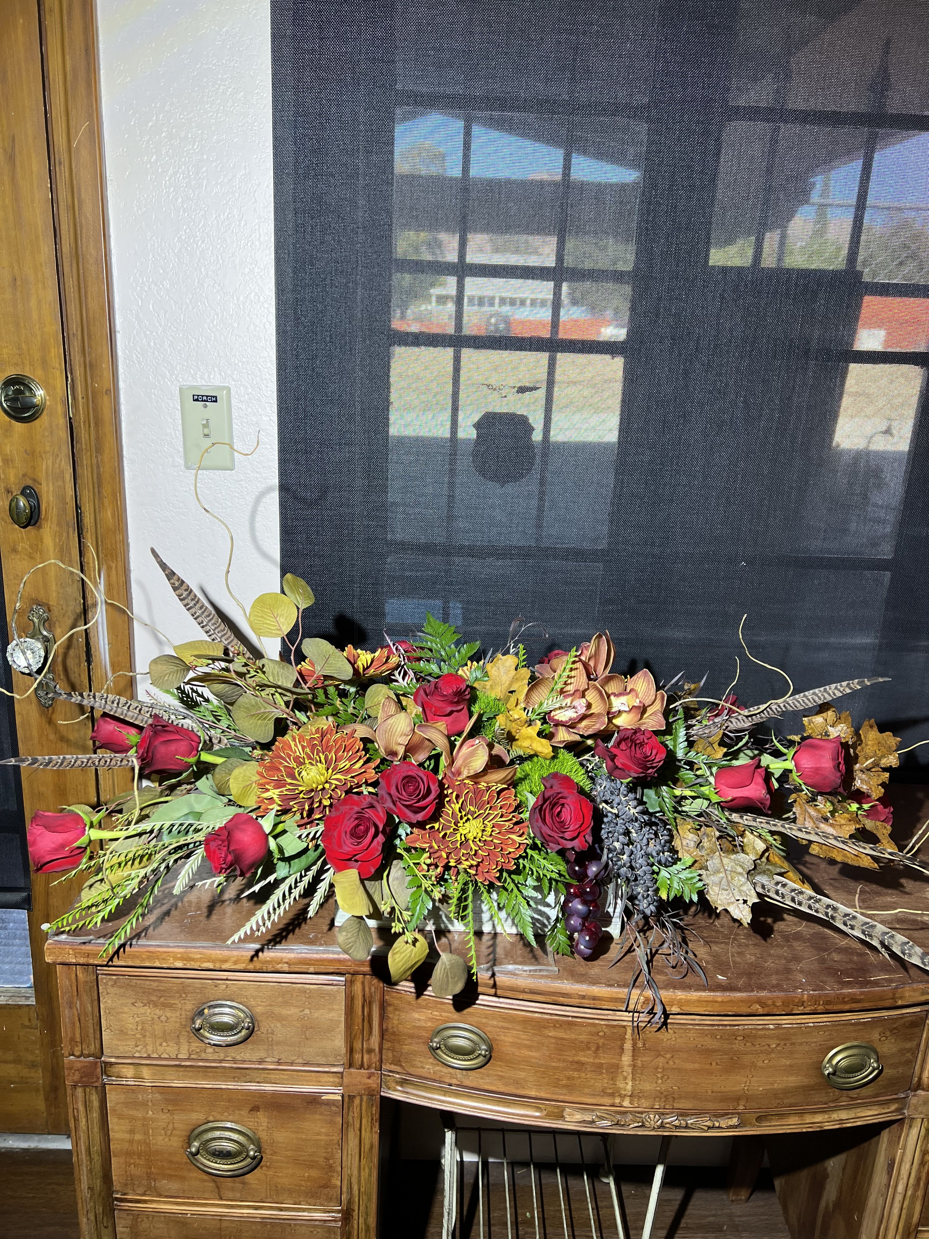 Rustic Centerpiece Rustic Centerpiece - Long Centerpiece with rustic color and pheasant feathers.