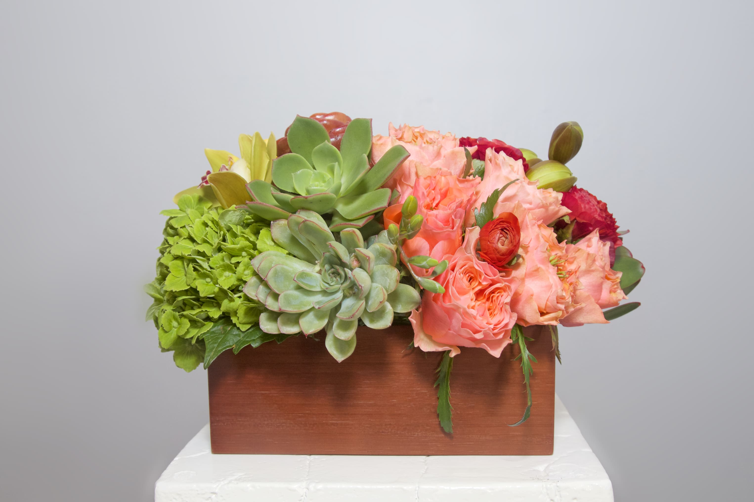 NoPa Nice and Naughty - This artful arrangement is perfection for the gifted artist, musician, poet... anyone who appreciates fun design. NoPa Nice and Naughty is an arrangement of Succulents, Proteas, Ranunculus, Orchids, Roses...