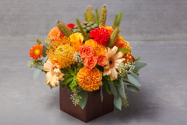 Sunset San Francisco - This eye-popping arrangement of dusk lit peaches, oranges, yellows and greens delivers both wow and pow to any end of day.    