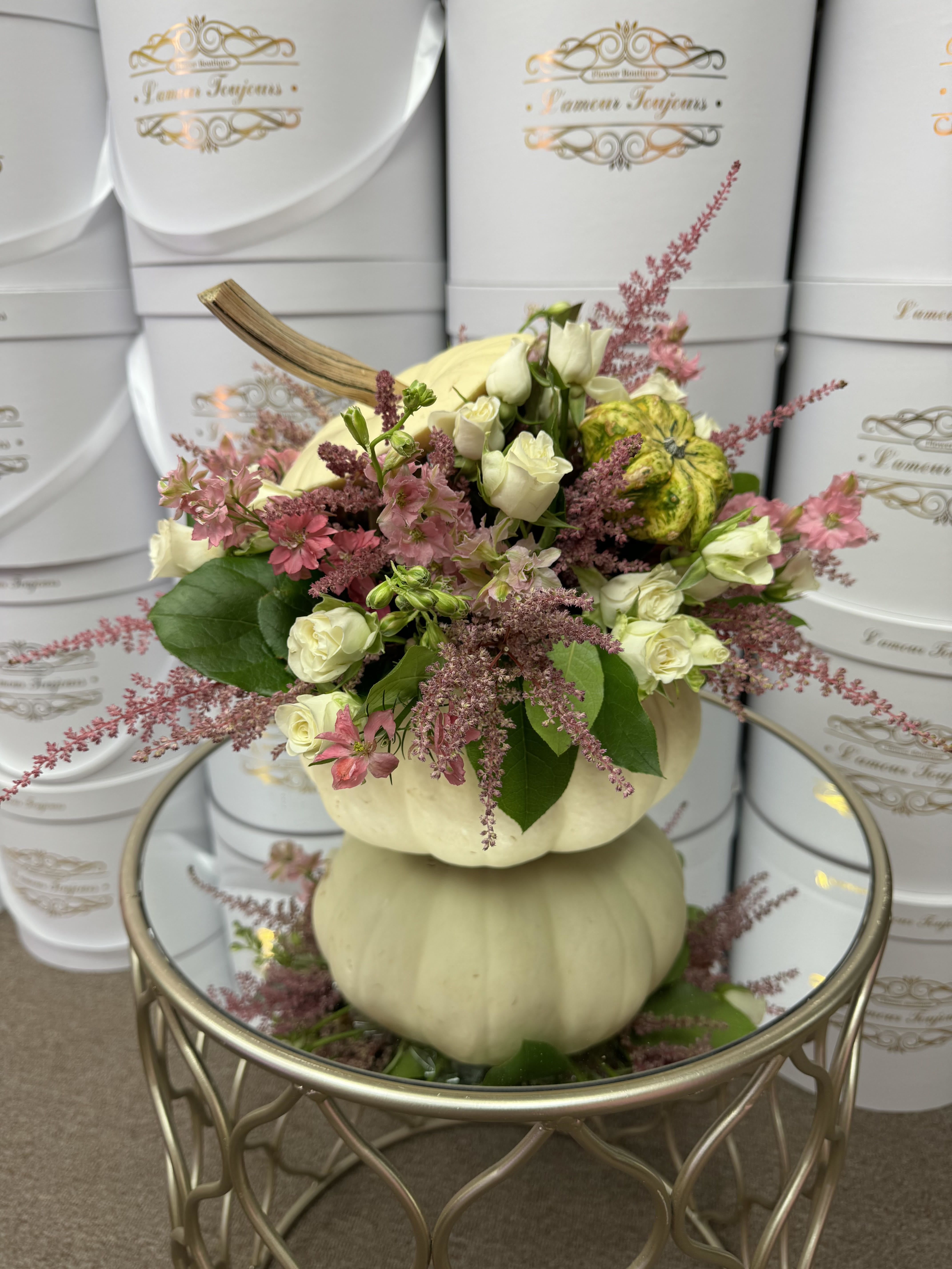 White Pumpkin Signature flowers III - Experience the exquisite fall flower selection in a freshly carved pumpkin.  