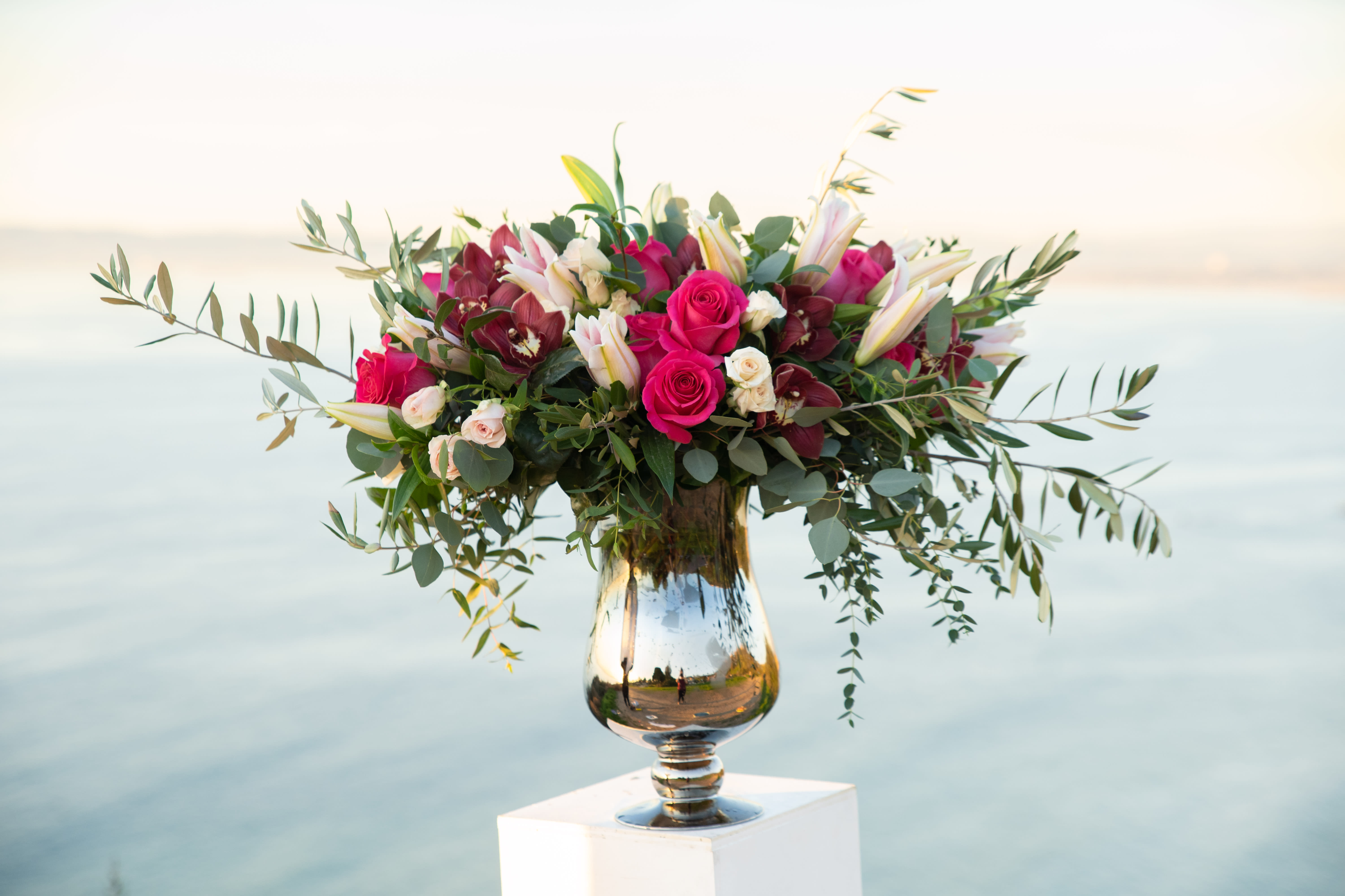 Showstopper - Grand Stargazer Lillies, Roses, Orchids  - This is the one that will get posted on instagram not just by the lucky recipient but also by their friends. In a luxury, reflective vase stand tall are an array of stargazer lilies, orchids, roses and and lush greenery. 
