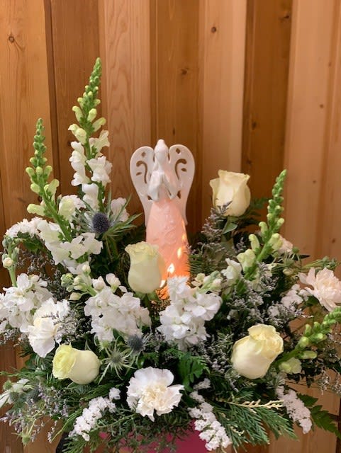 Angel in the Clouds  - White Angel – All White Flower Arrangement  Bring elegance, peace, and timeless beauty into any space with our White Angel in All White Flower Arrangement, thoughtfully designed by Haehn Florist &amp; Greenhouses in Wapakoneta, Ohio. This stunning arrangement features a graceful mix of fresh white flowers, symbolizing purity, love, and serenity. Perfect for sympathy gestures, memorial services, weddings, or as a sophisticated gift to brighten someone’s day, this all-white floral design offers a heartfelt way to express your emotions.  At Haehn Florist &amp; Greenhouses, 410 Hamilton Rd., Wapakoneta, OH 45895, our experienced floral designers create each White Angel arrangement with care and artistry, ensuring your gift arrives fresh and beautiful.  Whether you are sending comfort, celebrating a milestone, or adding a touch of elegance to your home, the White Angel arrangement is a timeless choice. Same-day delivery is available in Wapakoneta and surrounding areas.  Order the White Angel in All White Flower Arrangement today from Haehn Florist &amp; Greenhouses and let the beauty of flowers share your message of love and remembrance.