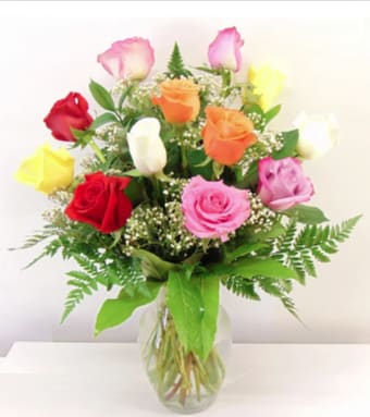 Classic Assorted Color Roses Classic Assorted Color Roses - For those who love the beauty of contrasting colors (or for those who can't remember their significant other's favorite color...) Assorted color roses arranged in a vase with baby's breath and greens (colors will vary). Standard (12 Roses), Deluxe (24 Roses), or Premium (36 Roses)