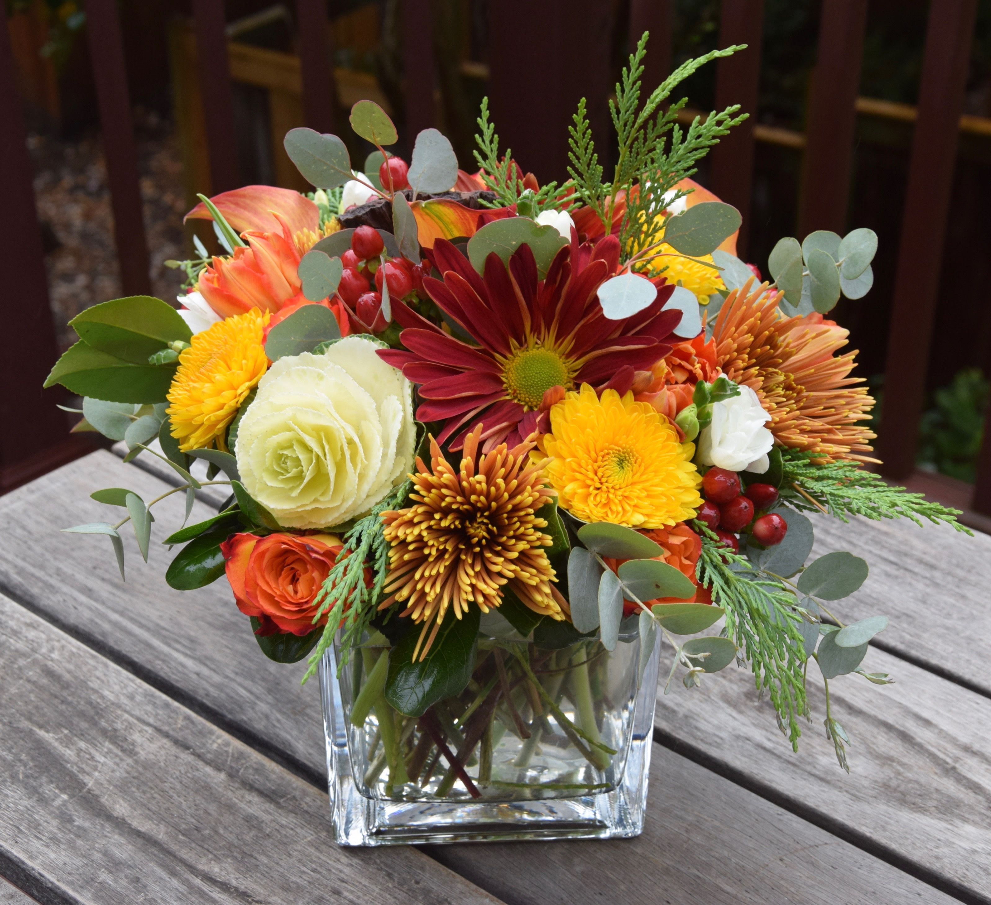 Bright Wishes for Fall - This arrangement is filled with all the bright wishes of the season. The flower assortment will vary but the wishes are always the best. Available in glass cube vase. 
