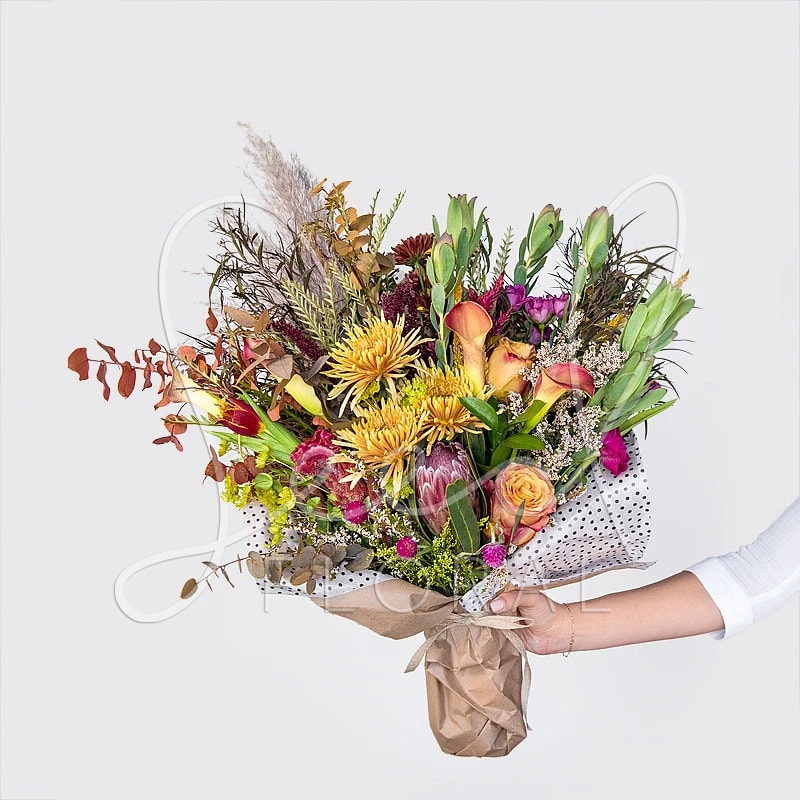 Seasonal Fall Bouquet - Enjoy a beautiful bouquet with the freshest flowers of the day created by our talented team of designers!  Just let us know which color scheme and size you have in mind.  **UPGRADE OPTIONS** STANDARD - Bountiful Bouquet  DELUXE - Bountiful Bouquet + Moonstruck Chocolate Bar PREMIUM - Bountiful Bouquet + Moonstruck Chocolate Bar + Candle (assorted scents)
