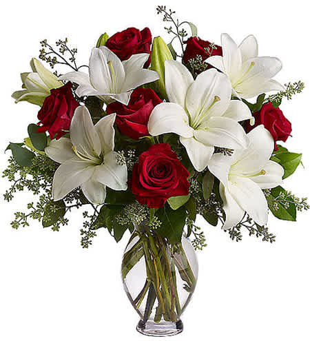 Forever Yours - Beautifully arranged with lovely roses, lilies, and greens, this bouquet truly radiates loving sympathy and tender support.  Add water daily to ensure your floral arrangement stays fresh and display the flowers in a cool location away from direct sunlight.