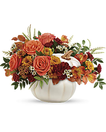 Teleflora's Enchanted Harvest Bouquet - Bursting from an enchanting white ceramic pumpkin, this fabulous fall mix of roses and mums is a magical addition to your autumnal gatherings! (Flowers &amp; Colors may vary!)