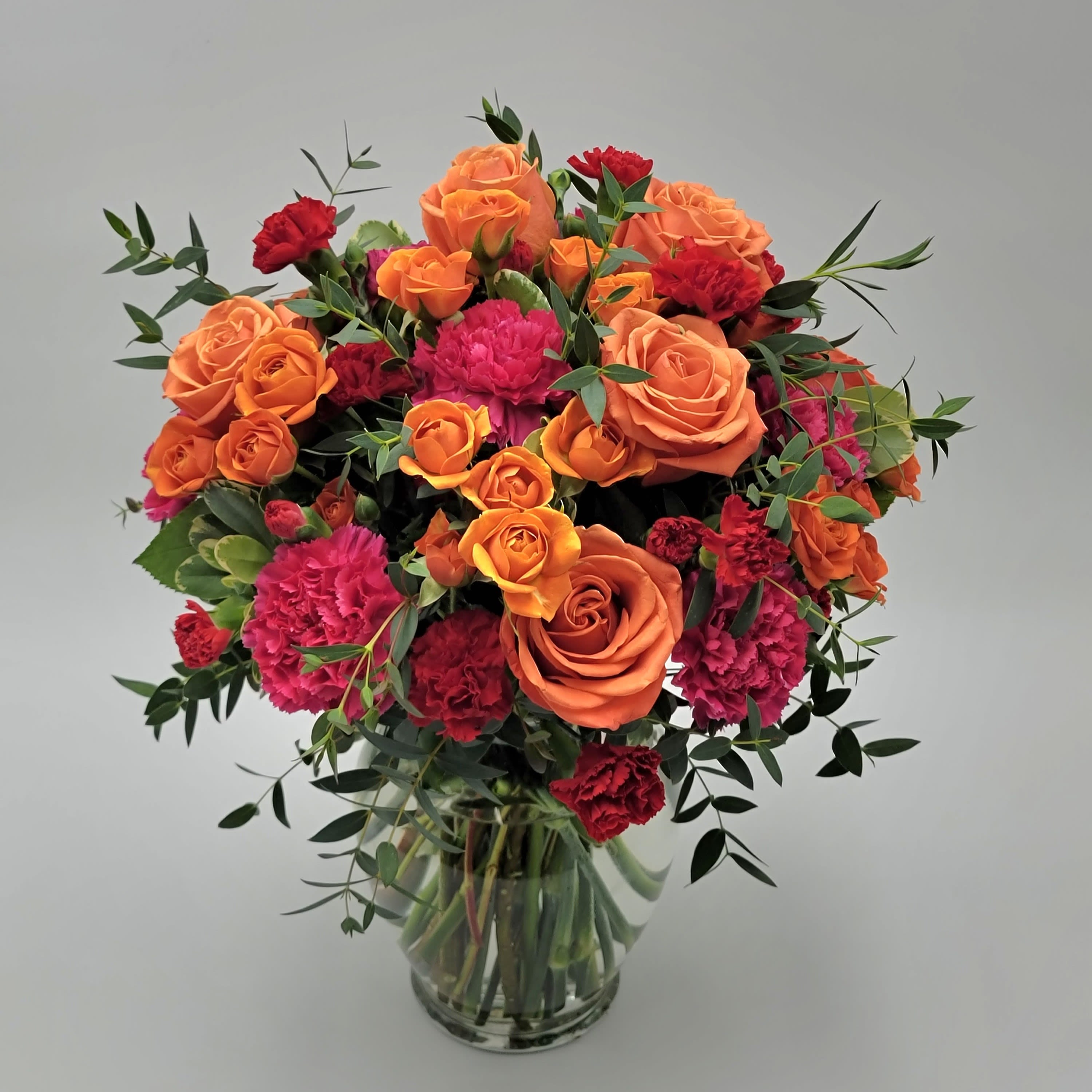 How Sweet It Is How Sweet It Is - Choose this very sweet and vibrant all-around arrangement to send today! Filled with roses, spray roses, carnations, and mini carnations. Approximately 11" tall by 10.5" wide.