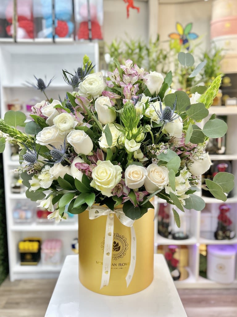 The Duchess Flower Box - Gold Box, White - The Duchess Flower Box: Go Royal! Assorted Roses and Baby Roses in blush colors accented with greens, hydrangeas, stars of Bethlehem decorated in our deluxe boxes. 1 face arrangement