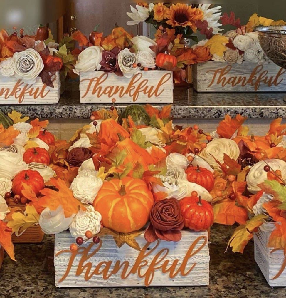 Thankful &amp; Harvest Pumpkin Centerpiece - Wood Flowers - Rustic 9&quot; rectangle centerpiece box filled with the colors of Autumn with fall leaves, pumpkins and gourds, and wood flowers in ivory, rose gold, and orange. Perfect to decorate your home for Autumn or to send to someone special. One side says Thankful and other side says Harvest.  Finished size is: 13” long 7&quot; wide 9-10” high Each arrangement is hand-made and therefore is unique and may differ slightly.  *****THESE ARE PERMANENT FLOWERS MADE FROM WOOD AND SILKS. NOT FRESH FLOWERS******** These can be shipped nationwide. 