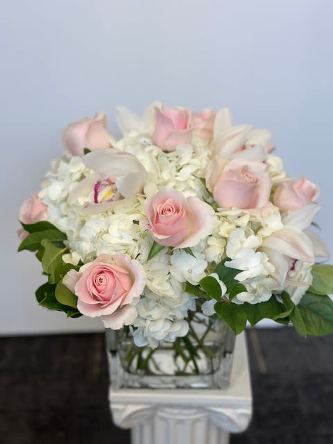 Elegant by Grohe Florists - This bouquet shows that there is beauty in simplicity. Elegant by  BloomNation™ is the perfect gift for almost any occasion, especially for celebrations and showing gratitude.    Arrangement Details: Includes white roses, blush pink roses, and white hydrangea all in a beautiful high quality vase. APPROXIMATE DIMENSIONS:10&quot; H X 11&quot; W X 11&quot;L