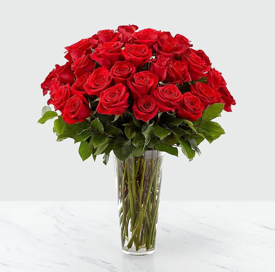 Exquisite Long Stem Red Rose Bouquet  - Nothing speaks of love so much as a bouquet of beautiful long stem red roses. Arranged in a classic glass vase, this bouquet is a gift to her heart from yours. 25&quot;h x 21&quot;w, 36, 42 or/48 Roses 