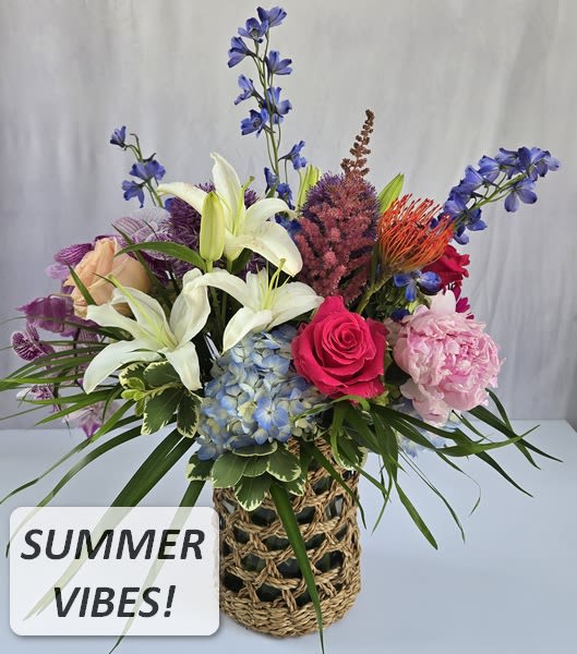 $145 Summertime Vibes! **LIMITED STOCK** Colorful English Garden Arrangement in quality keepsake woven grass with glass liner vase  - Summertime vibes mean beach season, hot colors and all natural - in a quality keepsake woven grass with glass liner container. Our talented designers use all elements of your order to create a one-of-a-kind arrangement to the value selected using the fresh premium flowers in our inventory. CALL 912.638.7323 TO DISCUSS OPTIONS!