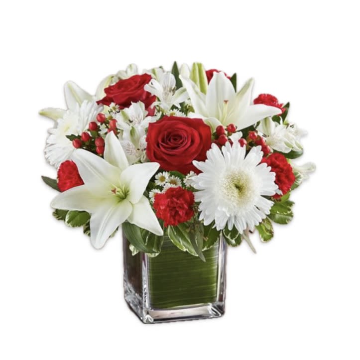 Healing Tears In Red and White - Healing Tears in Red and White is a beautiful mix of Red and White flowers in a leaf lined cube vase. This arrangement is available in 3 sizes and has roses in the Medium and Large Sizes only.