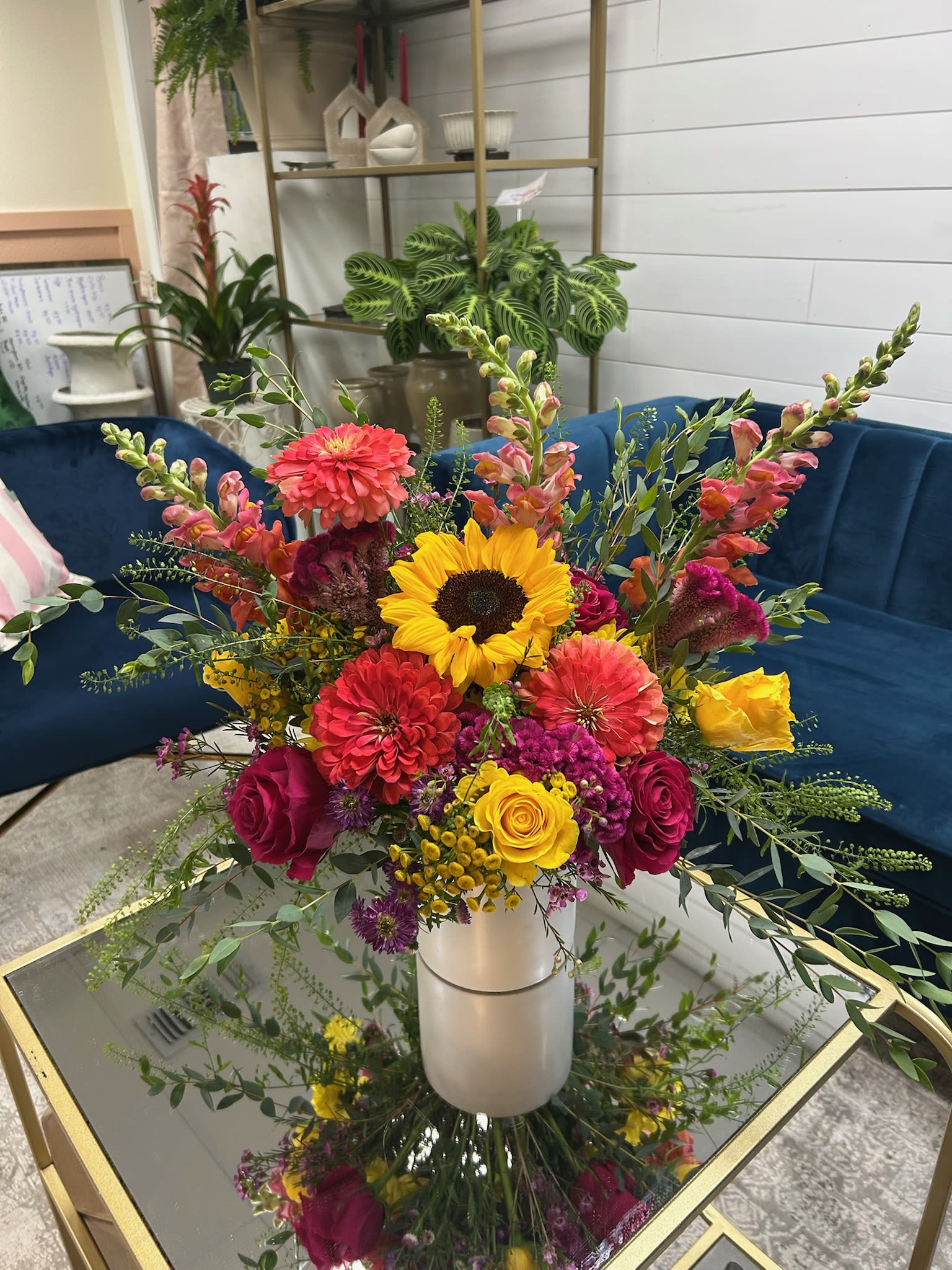 Sunlit Celebration Sunlit Celebration - A warm and radiant floral arrangement that captures the essence of late summer and early autumn.