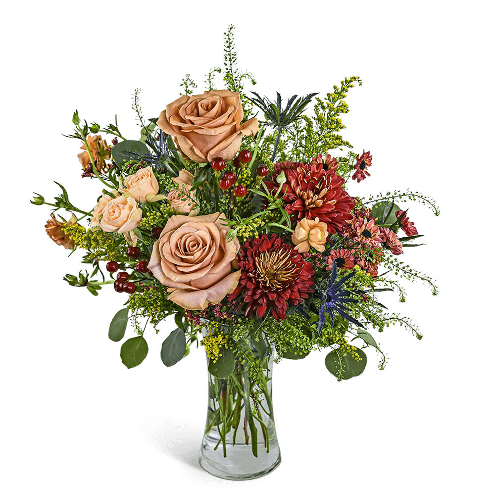 Chestnut Spice - Chestnut Spice is a graceful arrangement featuring soft neutral Roses, Berries, Thistle, and seasonal accent blooms in warm autumn tones. Designed in a clear glass vase, it's perfect for birthdays, anniversaries, or thoughtful flower delivery just because. Our local florist may make tasteful substitutions to ensure freshness and maintain the beauty of the design.