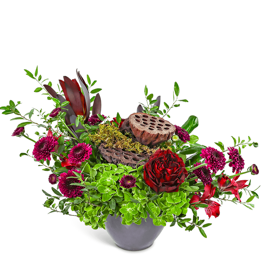 Natural Rosewood - Natural Rosewood blends rich red and burgundy blooms with green hydrangea and textural elements like moss and lotus pods for a truly earthy, elegant arrangement. Designed in a modern container, it's ideal for a dining table or office centerpiece. Our local florist may make thoughtful flower substitutions to ensure timely and beautiful flower delivery.