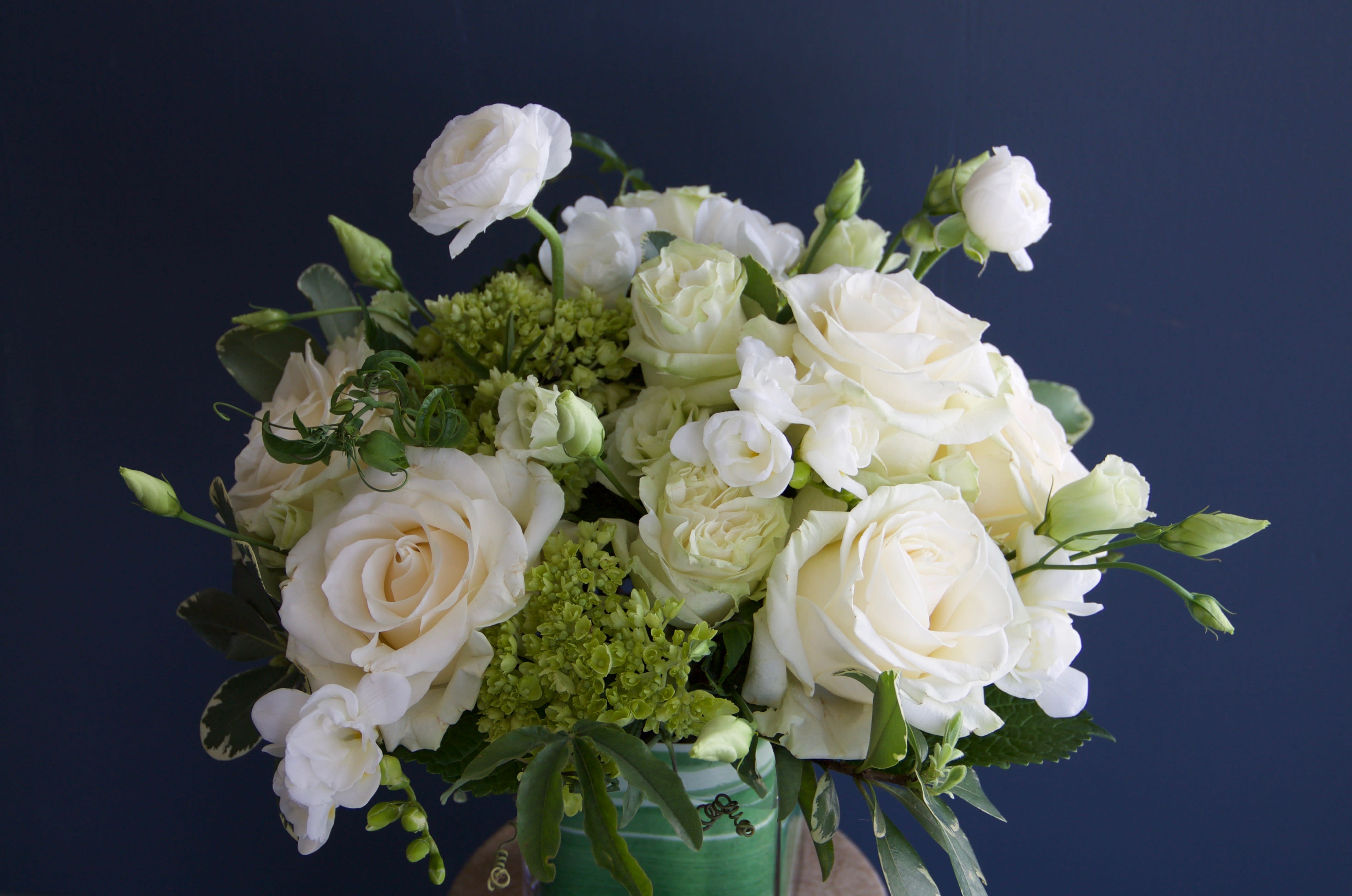 Classic White - An elegant arrangement with a classic and fresh green and white color palette. Perfect for any occasion or location.