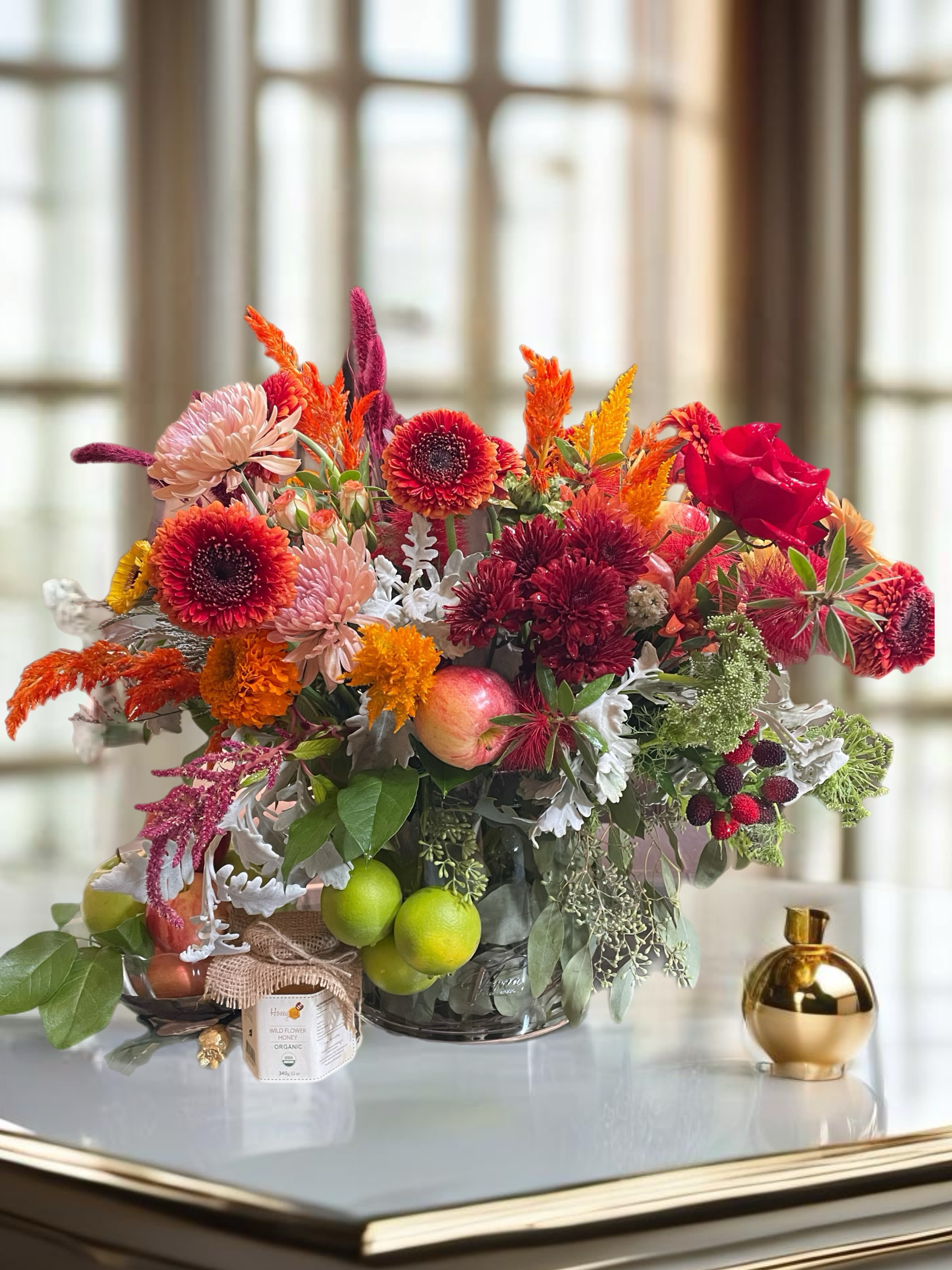 Happy Family Day ! - This arrangement in an elegant vase, with the orchids artfully displayed alongside fresh apples and a small dish of honey. The colors and textures blend harmoniously, creating a meaningful centerpiece that captures the spirit of family times, inviting joy and blessings for the upcoming year.