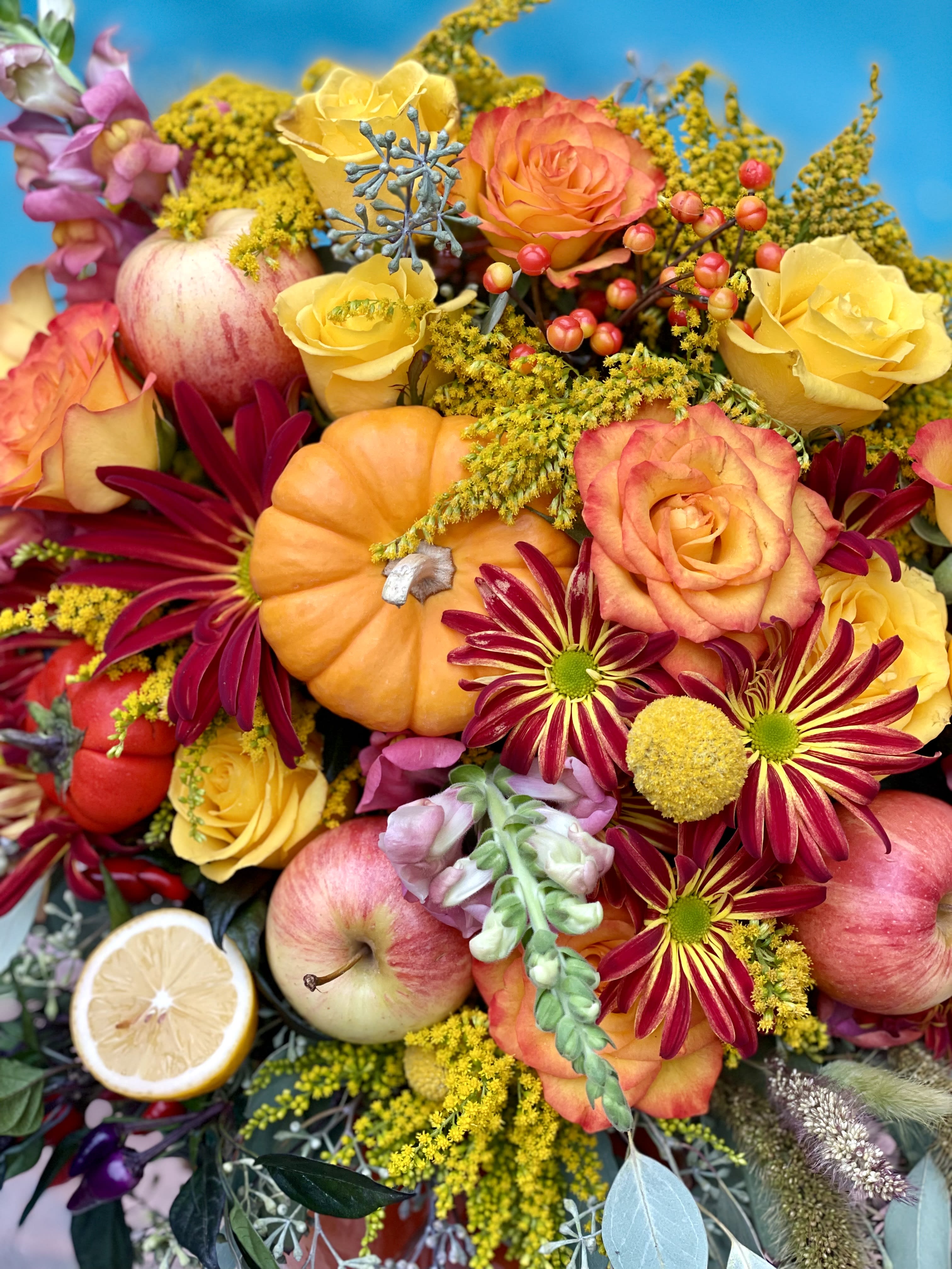 Falling in love with my pumpkin  - A pumpkin floral design is a charming and creative arrangement that combines the beauty of flowers with the natural appeal of a pumpkin. With a medium-sized pumpkin as the base, flowers and greenery are carefully arranged inside, creating a visually pleasing and unique centerpiece. The colors, textures, and shapes of the flowers and greenery add a touch of elegance and autumnal charm, making it a perfect decorative item for any occasion or space.