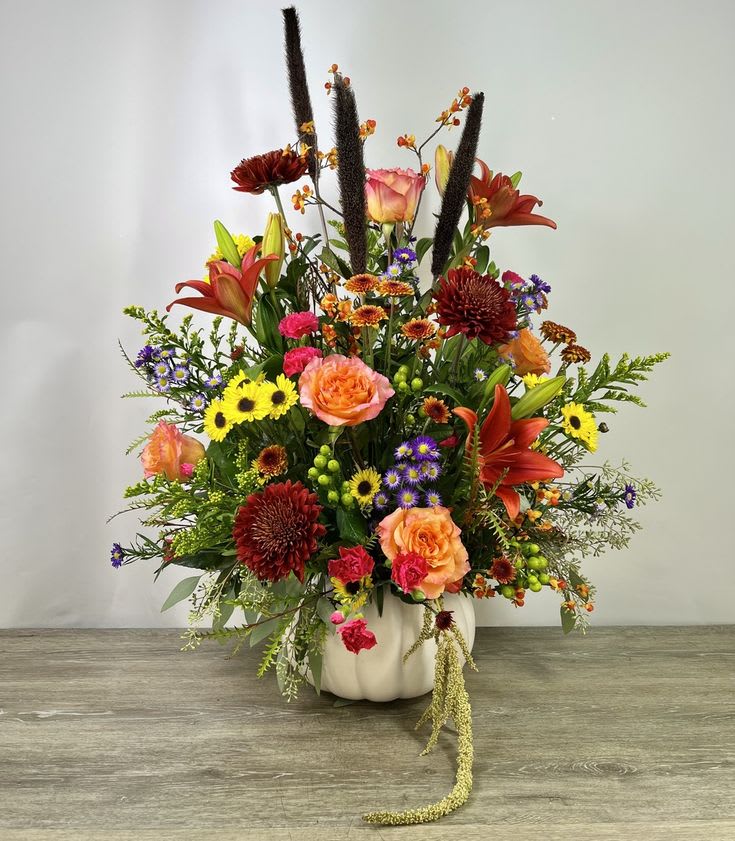 Festival of pumpkin s  - &quot;The Festival of Pumpkins: A Bountiful Floral Gift&quot;  Immerse yourself in the spirit of the season with our &quot;Festival of Pumpkins&quot; floral gift. This arrangement captures the essence of autumn's harvest, blending the rich and warm colors of fall with a delightful array of pumpkins and fresh blooms.  Each element in this gift represents the bountiful celebration of the season. It's a beautiful reminder of the abundance and the cozy, festive atmosphere that the fall season brings. Whether for your own home decor or as a heartwarming gift for someone special, our &quot;Festival of Pumpkins&quot; floral arrangement is a true celebration of this cherished time of year.     